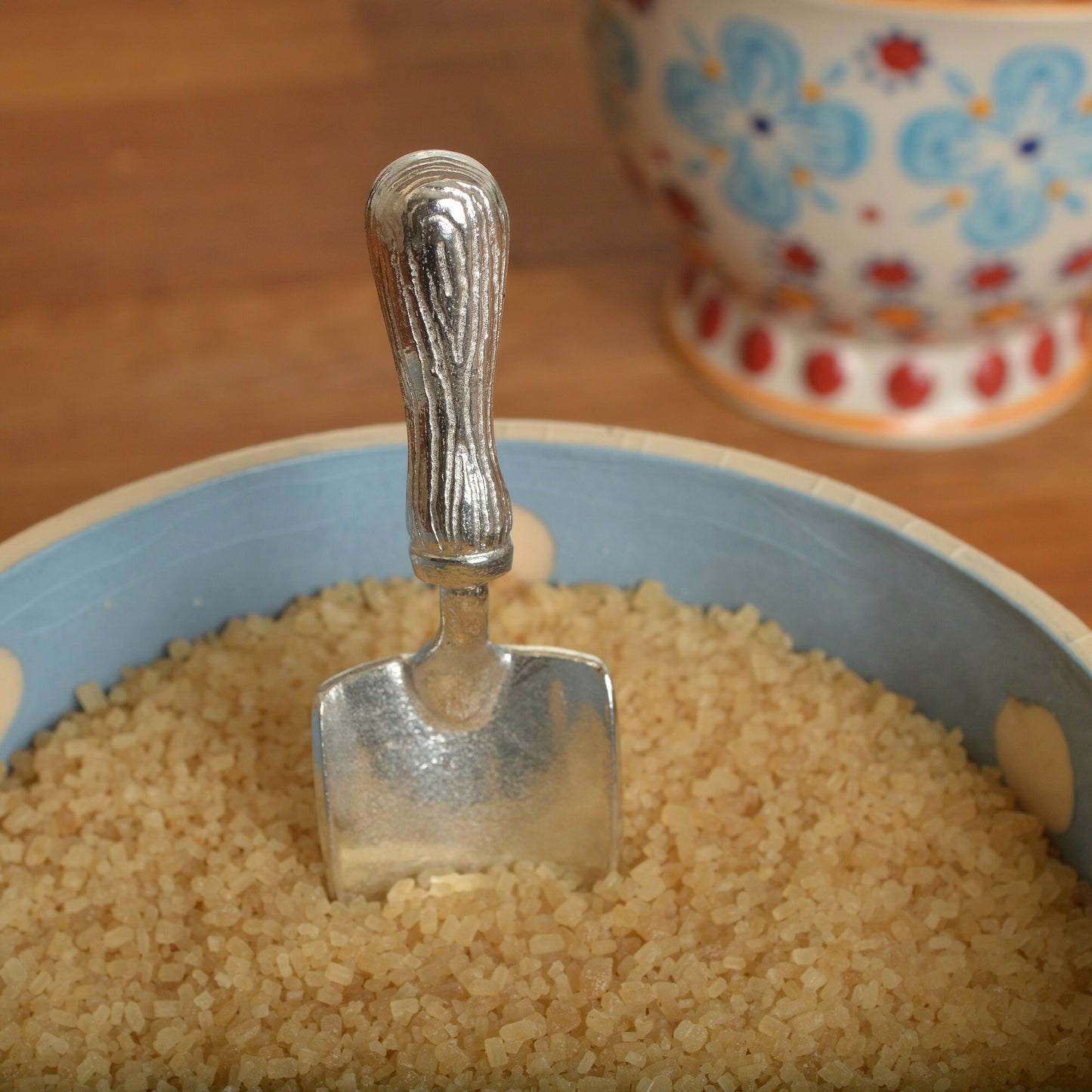 A small spoon pewter sugar spoon in the shape of a garden trowel . Unusual, useful and tactile gifts for gardeners and garden lovers handmade in the UK useful countryside gifts