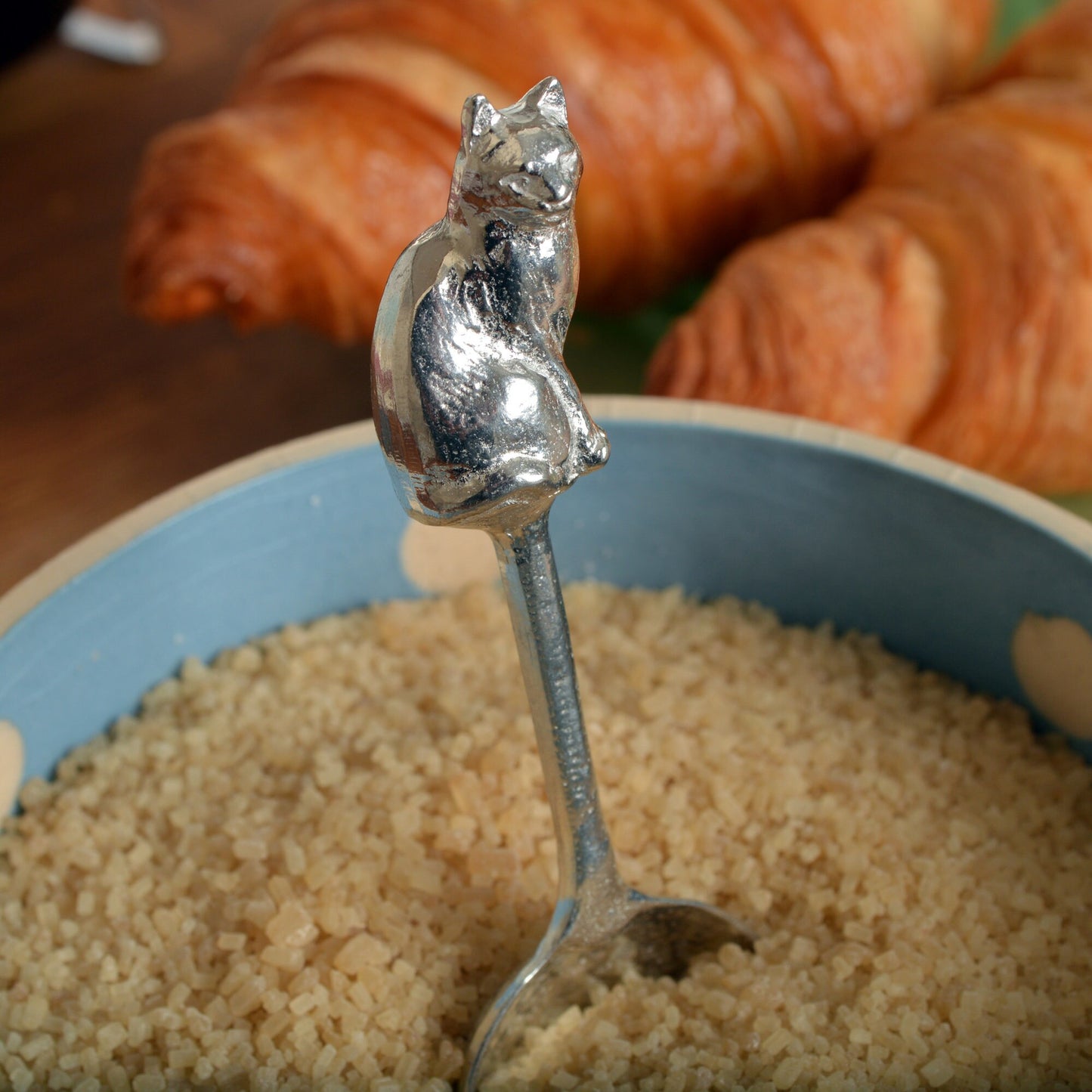 A small spoon pewter sugar spoon. A round bowled spoon on a straight handle leads to a perfectly sculpted cat. Practical & useful cat gifts for cat lovers. UK handmade