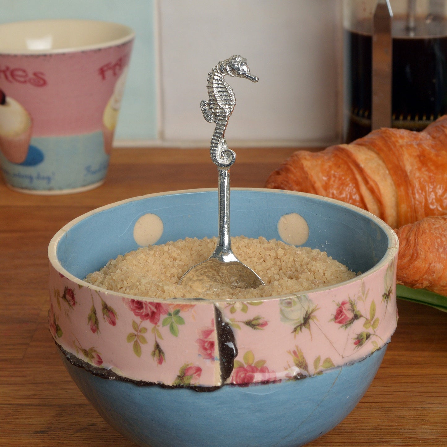 A small spoon pewter sugar spoon. A round bowled spoon on a straight handle leads to a perfectly sculpted seahorse. Practical & useful nautical gifts for seahorse lovers. UK handmade