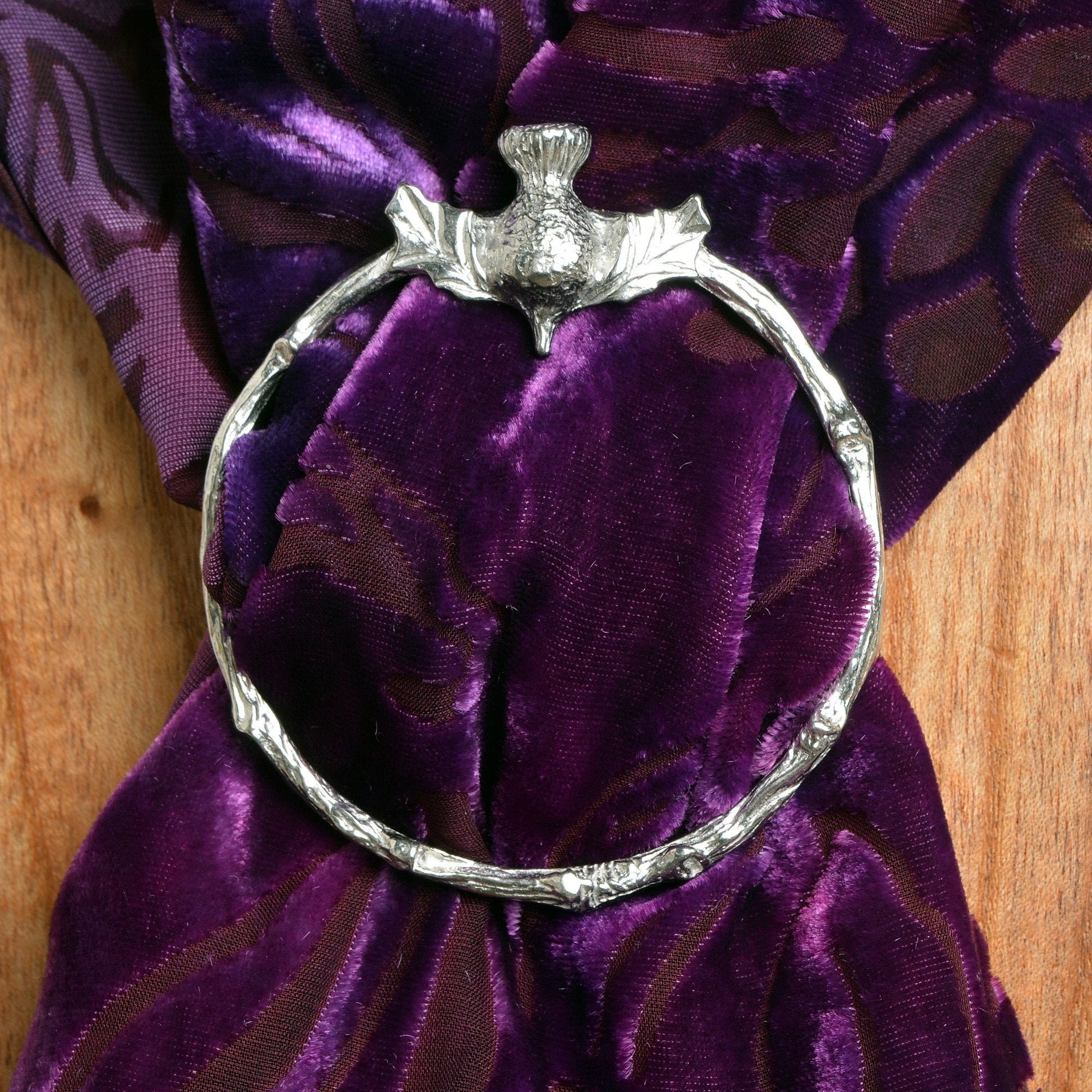 Thistle scarf ring. A splendid Scottish thistle sits on the top of a twig textured ring on this decorative pewter ring for scarves. It will fit most large velvet, silk, cotton or wool scarves. Scottish gifts For her, thistle gifts, gifts for Scots.