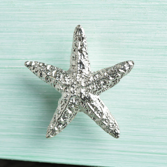 A solid pewter cabinet handle, cupboard knob, furniture handle or drawer pull in the shape of a detailed starfish. Organic, unusual handles UK handmade with finesse