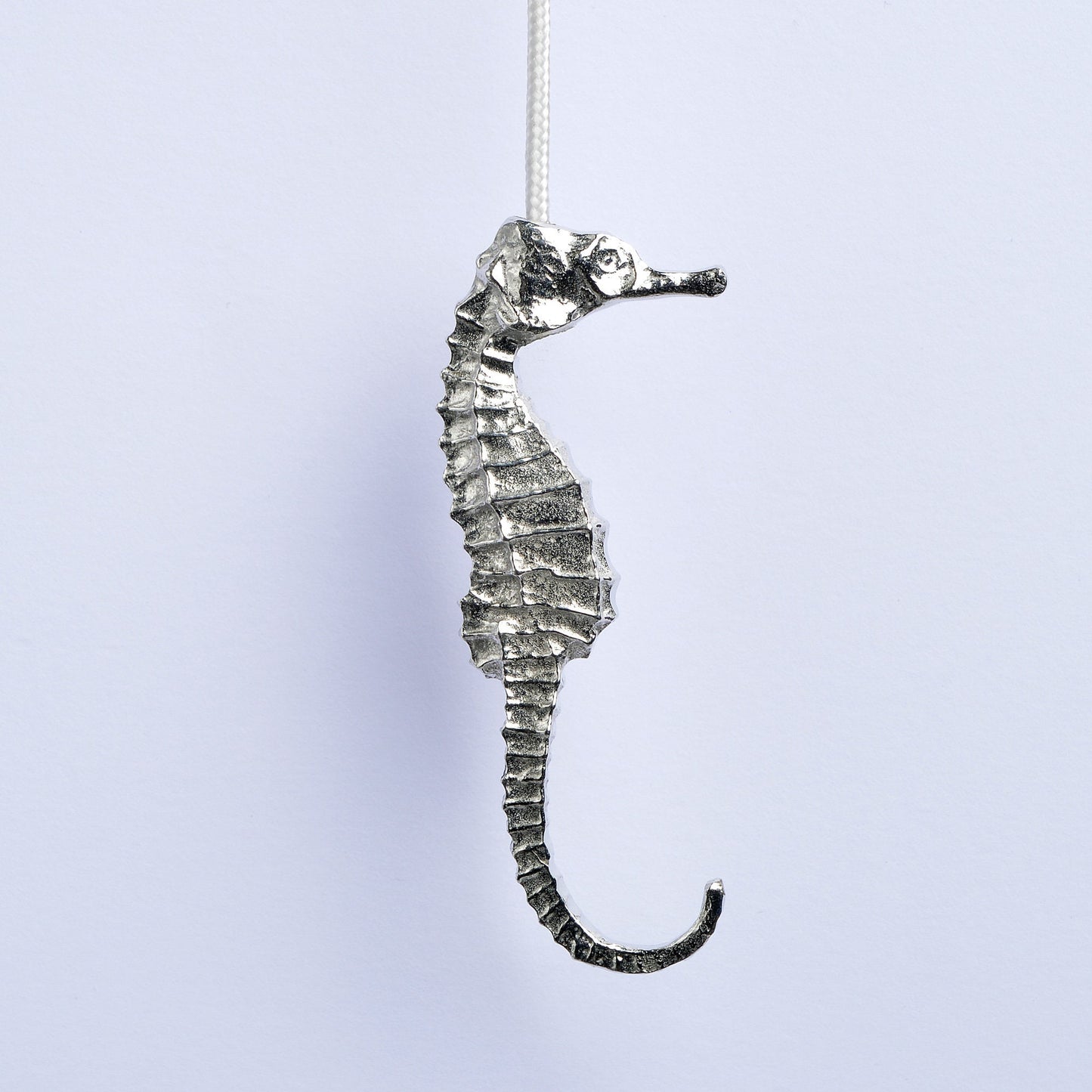 Seahorse bathroom light pull or cord pull. A tactile and decorative pewter seahorse hangs at the bottom of the bathroom light switch cord. ideal little housewarming gifts. Seahrse gifts for seahorse lovers.