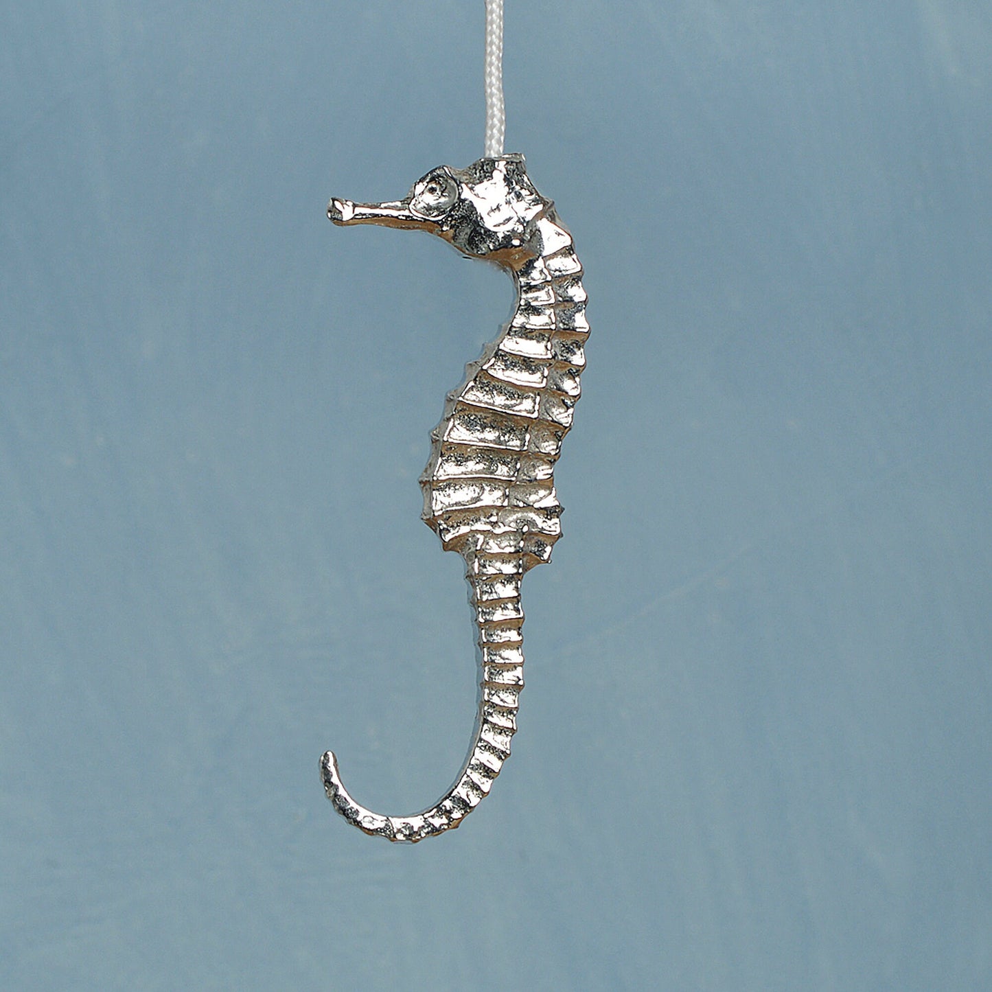 Seahorse bathroom light pull or cord pull. A tactile and decorative pewter seahorse hangs at the bottom of the bathroom light switch cord. ideal little housewarming gifts. Seahrse gifts for seahorse lovers.