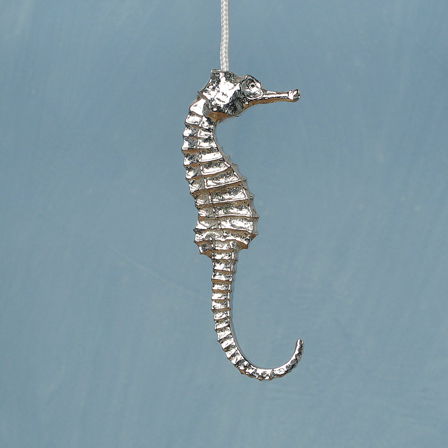 Seahorse bathroom light pull or cord pull. A tactile and decorative pewter seahorse hangs at the bottom of the bathroom light switch cord. ideal little housewarming gifts. Seahrse gifts for seahorse lovers.