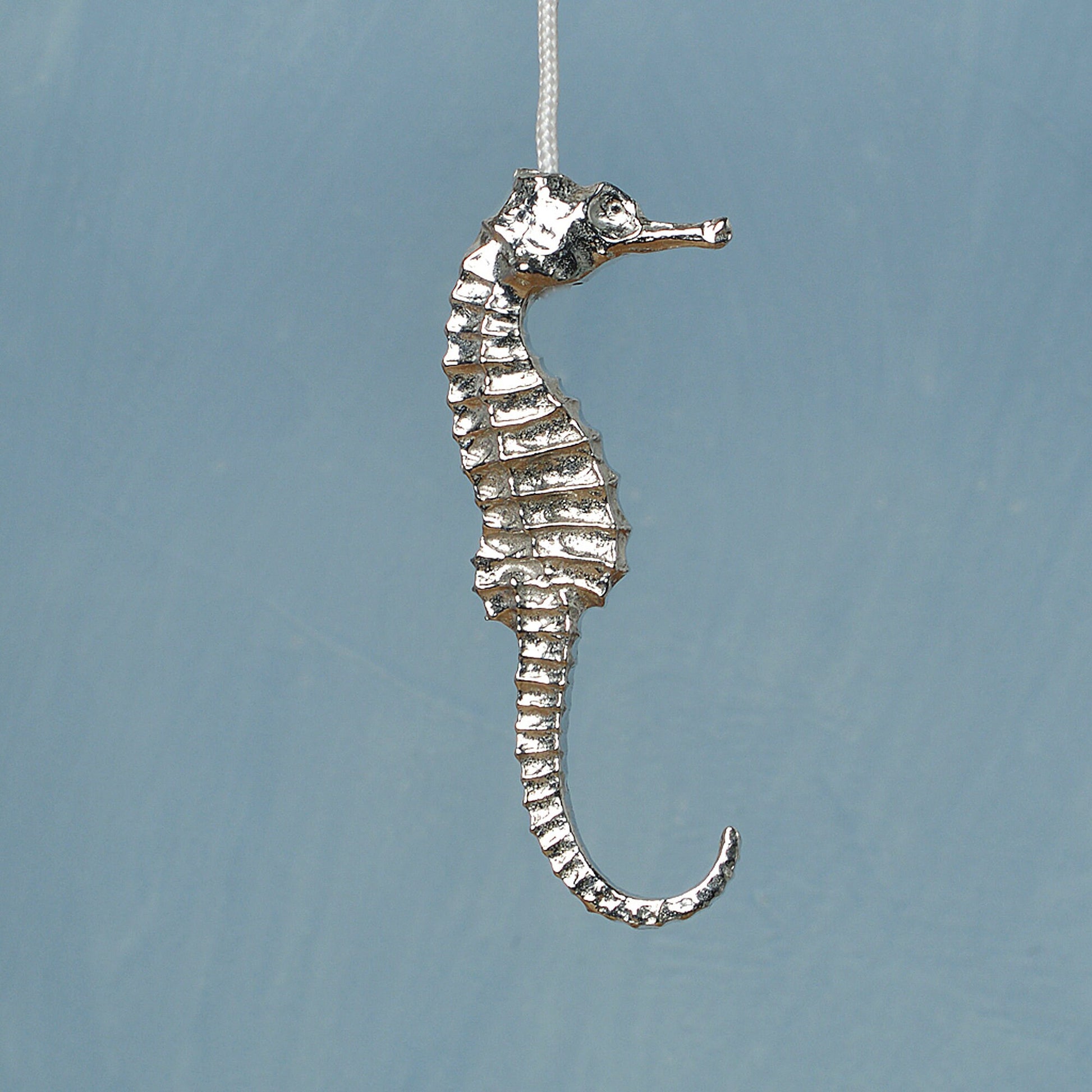 Seahorse bathroom light pull or cord pull. A tactile and decorative pewter seahorse hangs at the bottom of the bathroom light switch cord. ideal little housewarming gifts. Seahrse gifts for seahorse lovers.