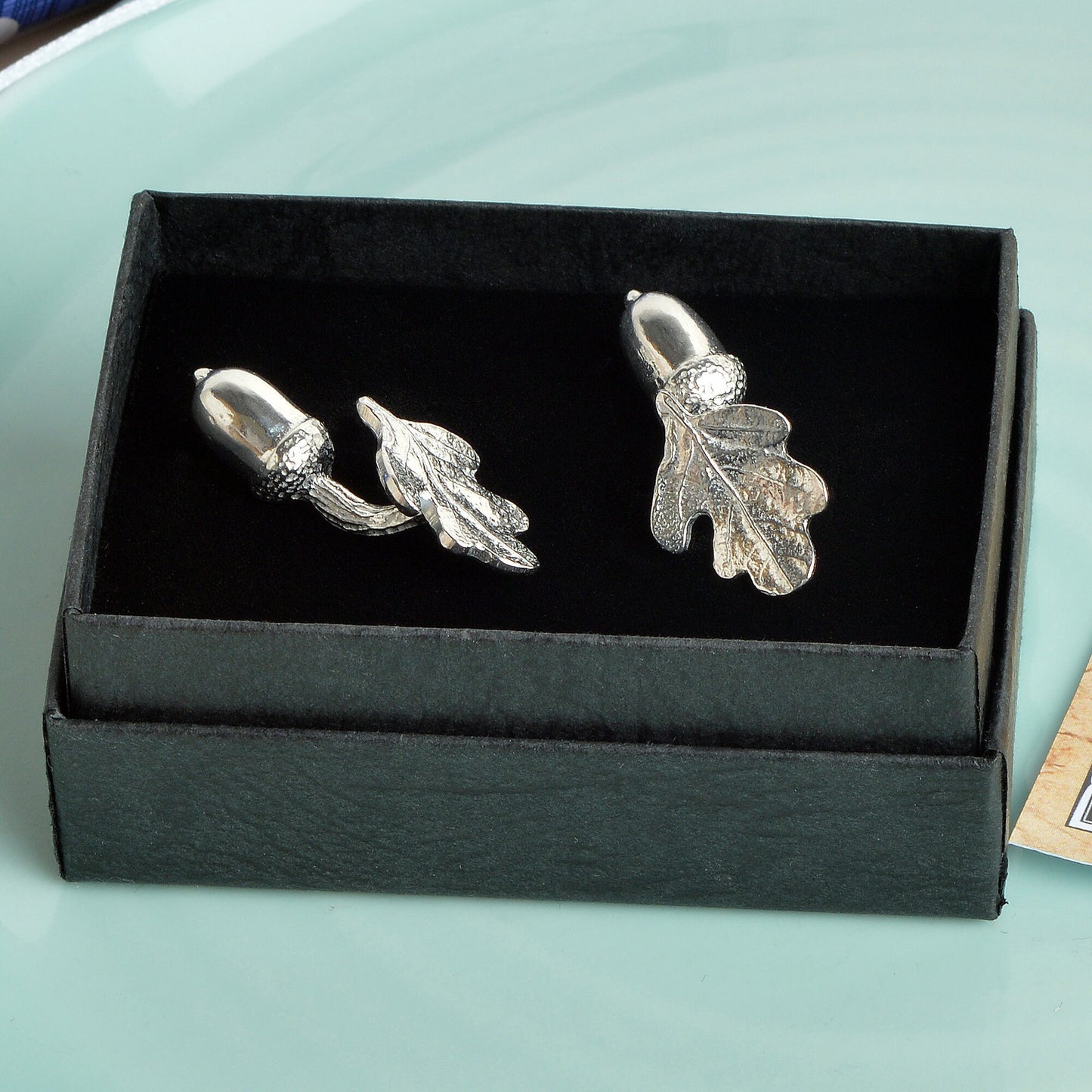 A pair of pewter acorns linked to  oak leaves via twig stems make a practical and beautiful cufflinks. 'Great oaks from little acorns grow'. Christening gifts for boys for use in later life. With certificate from giver.