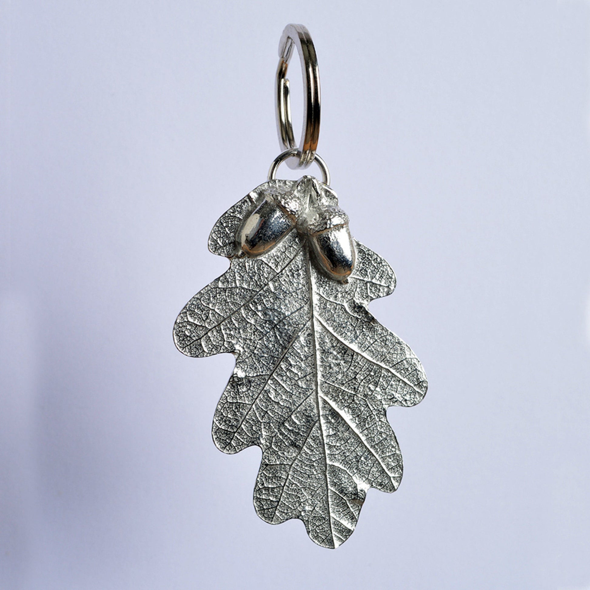 A detailed and beautifully textured oak leaf and acorn keyring. A large, strong and sturdy English pewter oak leaf keyring on a stainless steel ring. Oak and acorn gifts, housewarming gifts UK handmade