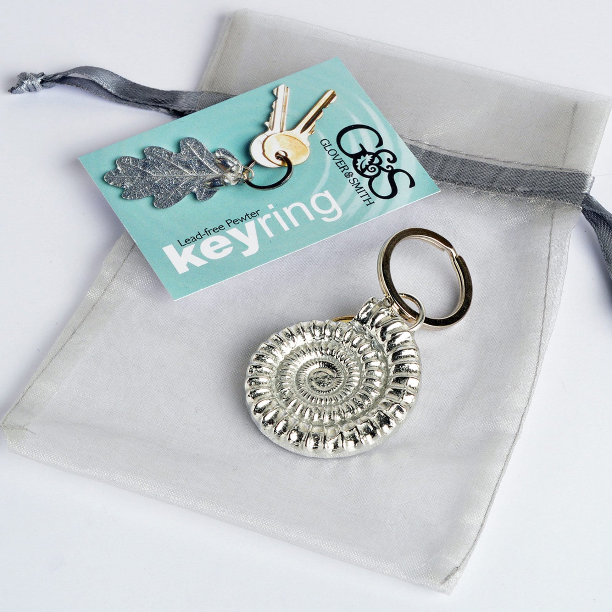 An elegant and beautiful solid pewter ammonite keyring on a quality stainless steel ring. Fossil gifts, geology gifts, ammonite gifts. Pewter keyring gifts, housewarming gifts.