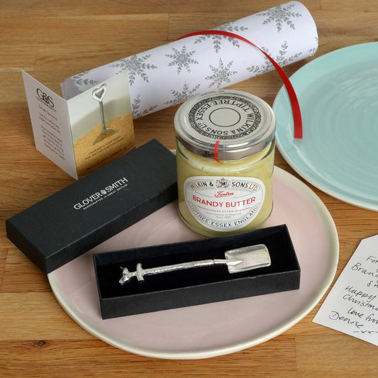 A small spoon pewter sugar spoon in the shape of a garden spade with a robin sitting on the handle . Brandy butter spoon, Christmas table gifts.