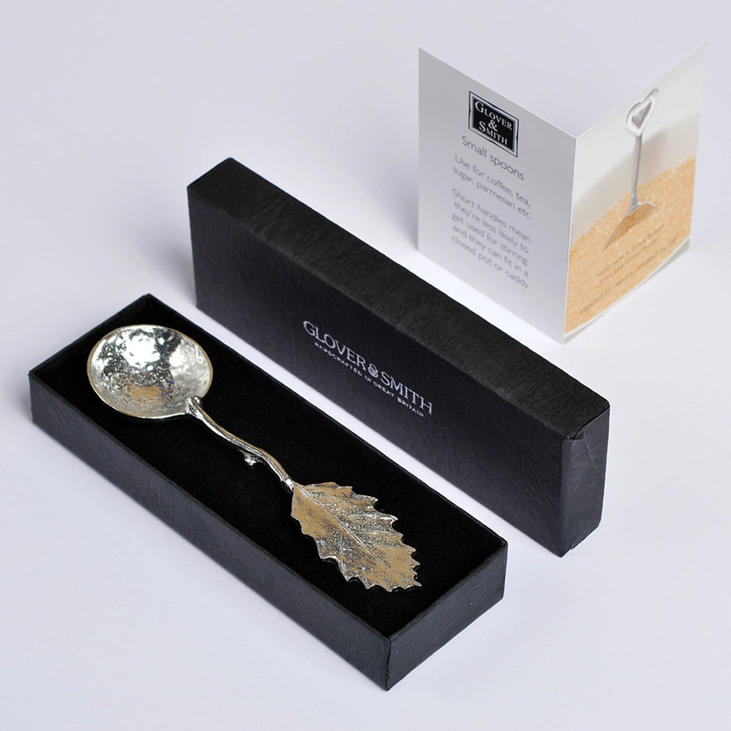 A small spoon pewter sugar spoon with a detailed chestnut leaf on the end of a twig handle. Unusual, useful and tactile gifts for nature lovers handmade in the UK