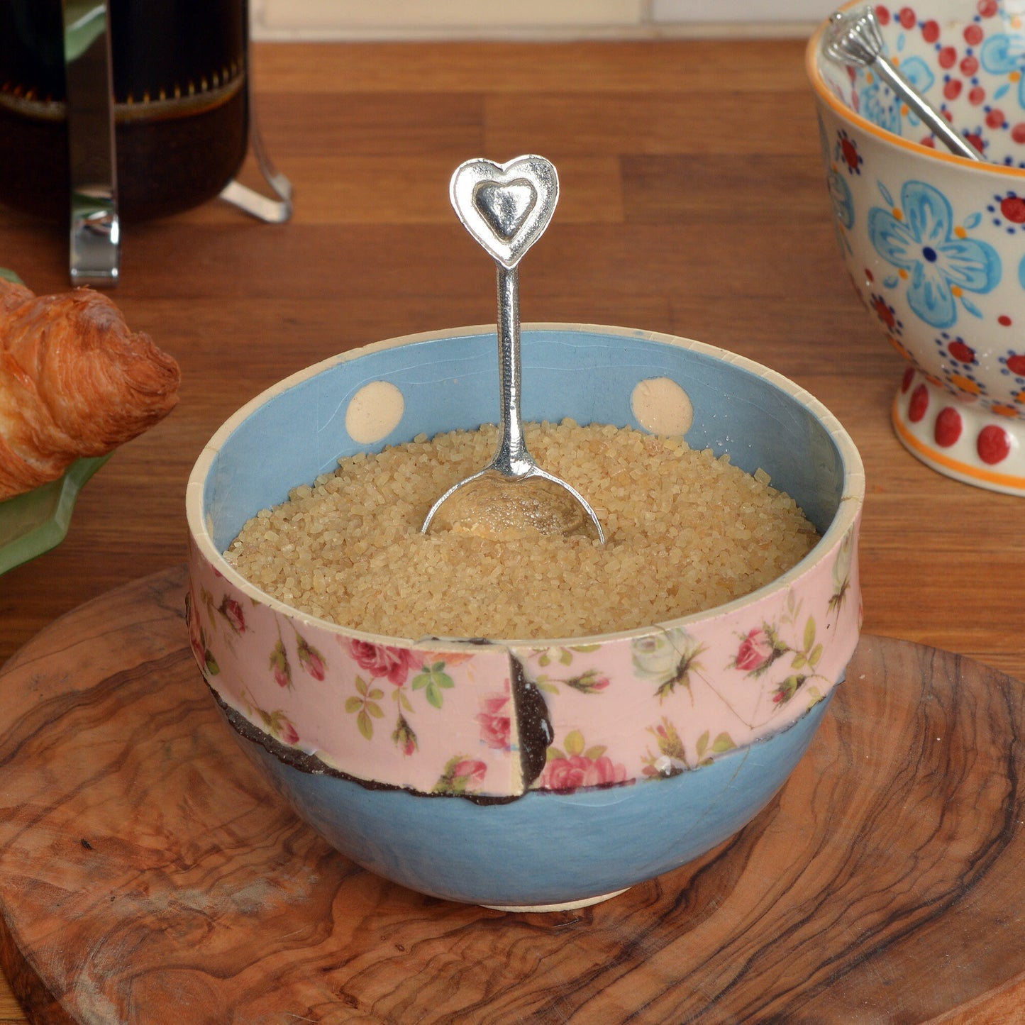 A small spoon pewter sugar spoon  with 2 love hearts on the end. Our love spoon makes an ideal little love token or 10th tin wedding anniversary gift or small wedding gift.