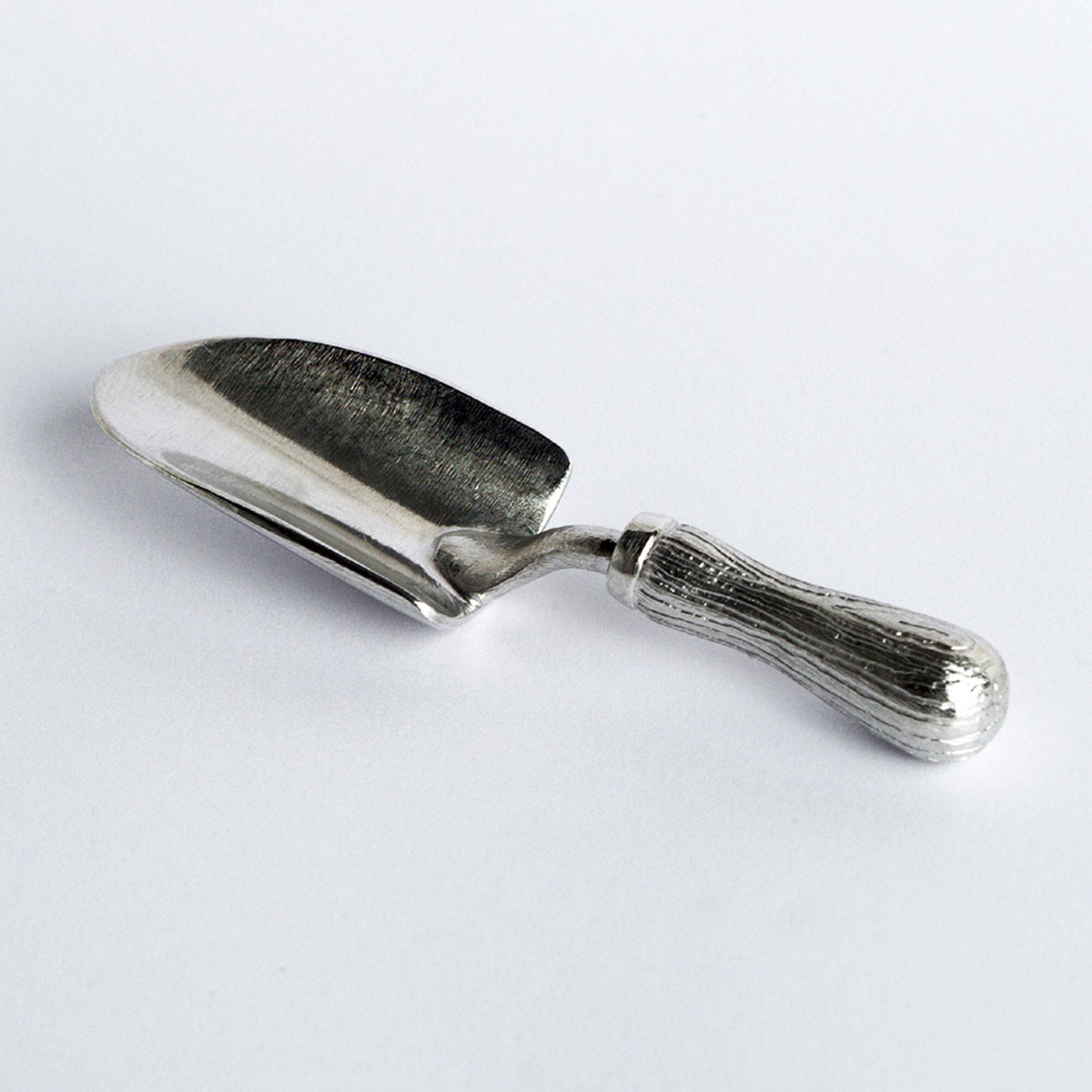 A small spoon pewter sugar spoon in the shape of a garden trowel . Unusual, useful and tactile gifts for gardeners and garden lovers handmade in the UK useful countryside gifts