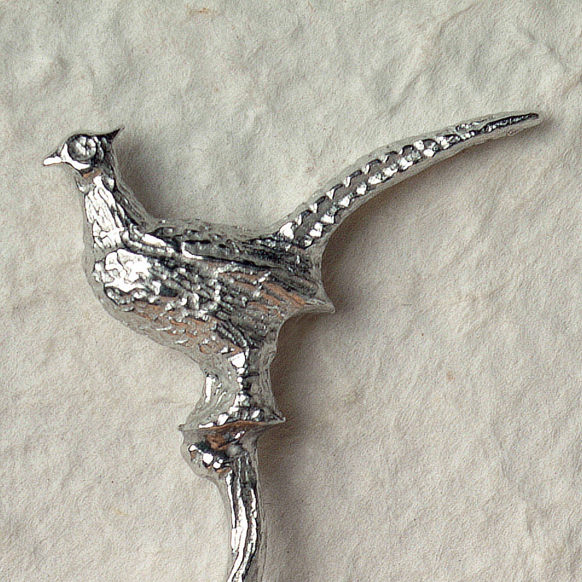 A small spoon pewter sugar spoon with a detailed pheasant on  a twig handle. Unusual, useful and tactile gifts for nature lovers, pheasant shooting gifts handmade in the UK useful countryside gifts