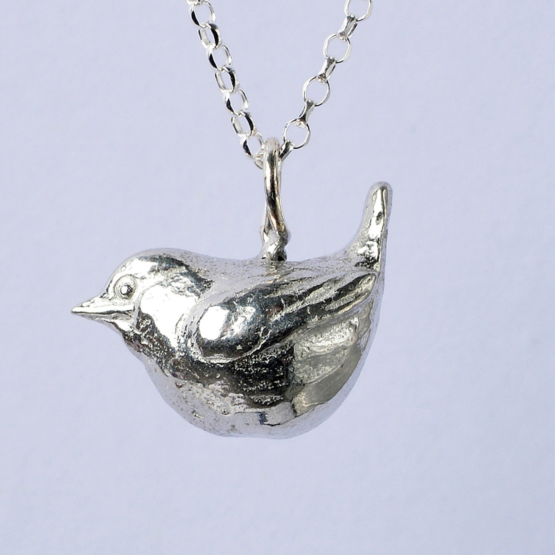 A delicate and detailed pewter wren bird necklace on an 18" Sterling silver chain. Great jewellery gifts for her, bird gifts for bird lovers. The perfect 10th tin 10 year wedding anniversary gift (Our pewter is 95% tin). Made in Britain with love. 