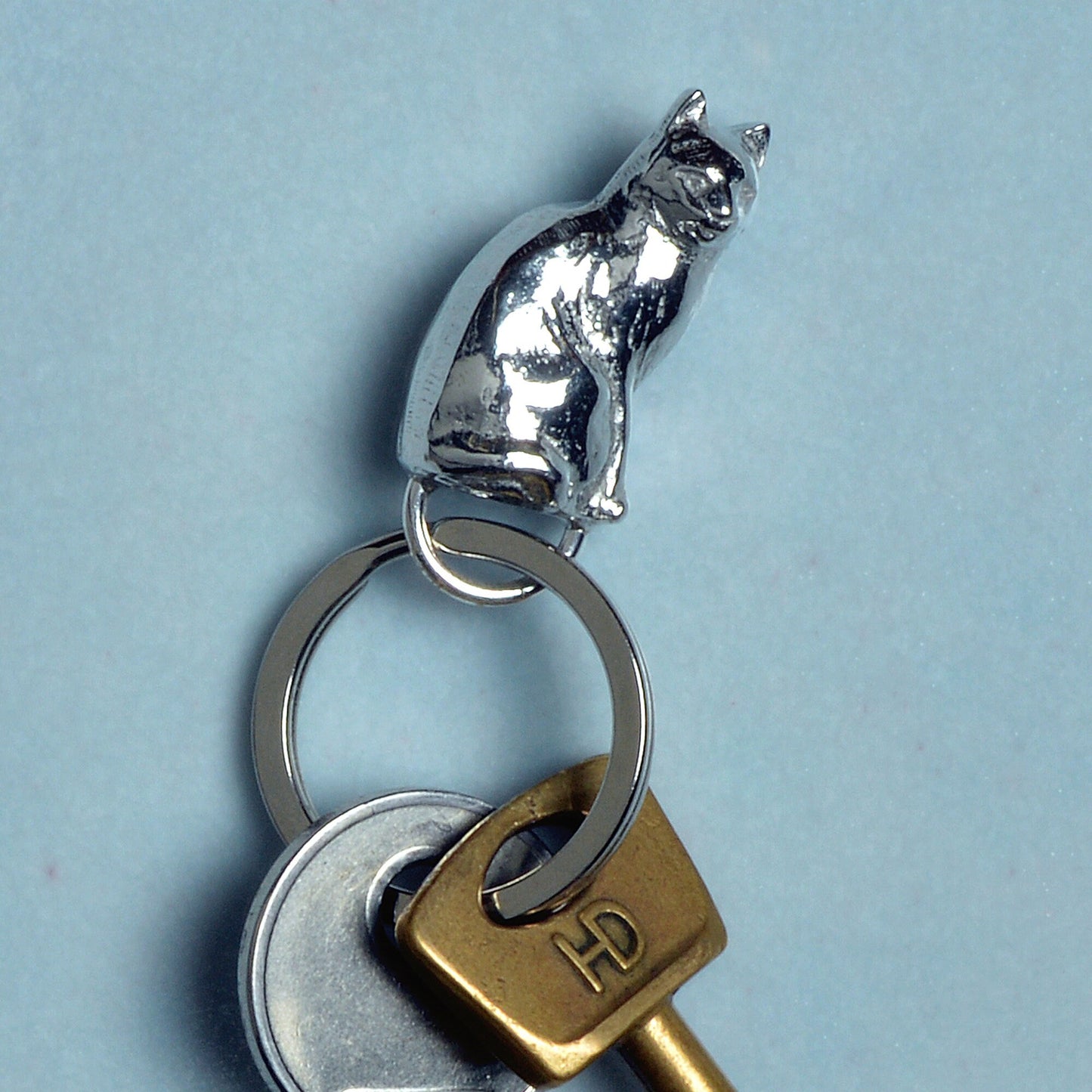 An elegant and beautiful solid pewter cat keyring on a quality stainless steel ring. Cat gifts, gifts for cat lovers, Pewter keyring gifts. Housewarming gifts.