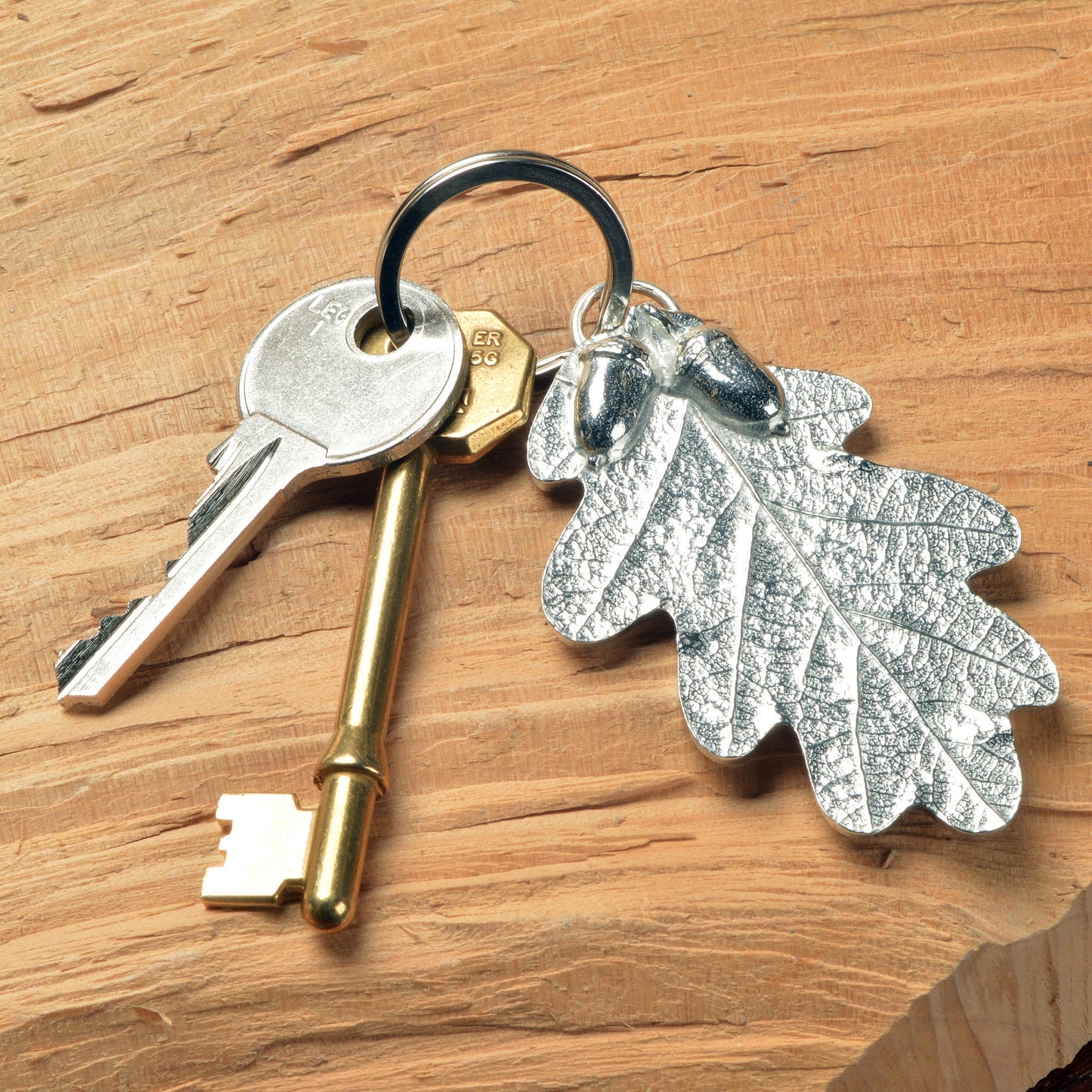 A detailed and beautifully textured oak leaf and acorn keyring. A large, strong and sturdy English pewter oak leaf keyring on a stainless steel ring. Oak and acorn gifts, housewarming gifts UK handmade