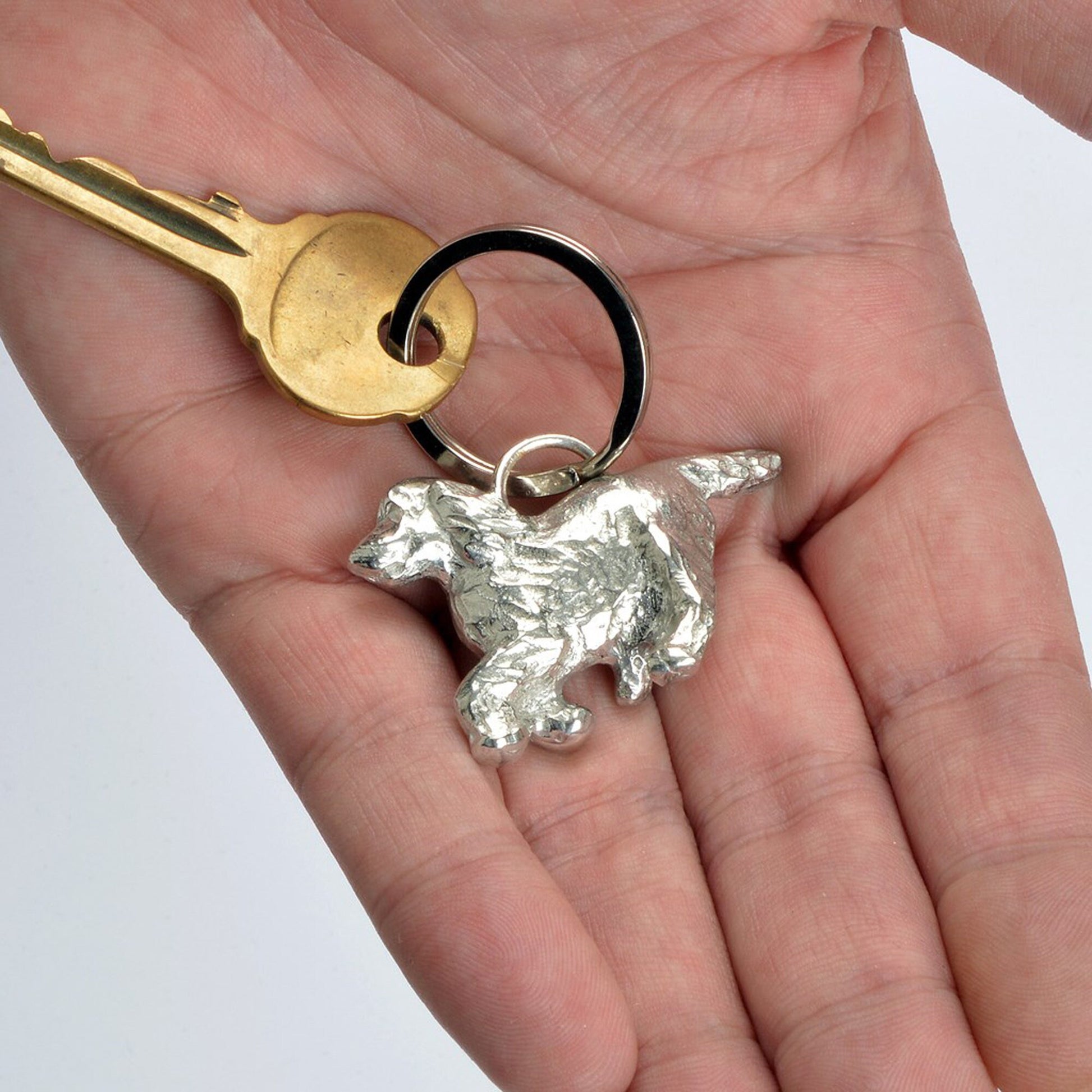 An elegant and beautiful solid pewter spaniel keyring on a quality stainless steel ring. Cocker Spaniel gifts, gifts for dog lovers. Springer Spaniel gifts, pewter keyring gifts. Housewarming gifts.