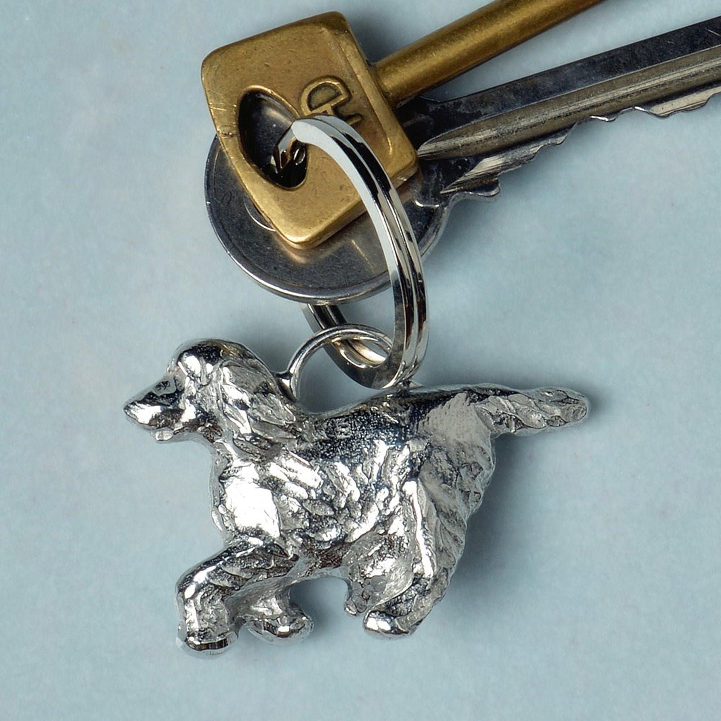 An elegant and beautiful solid pewter spaniel keyring on a quality stainless steel ring. Cocker Spaniel gifts, gifts for dog lovers. Springer Spaniel gifts, pewter keyring gifts. Housewarming gifts.