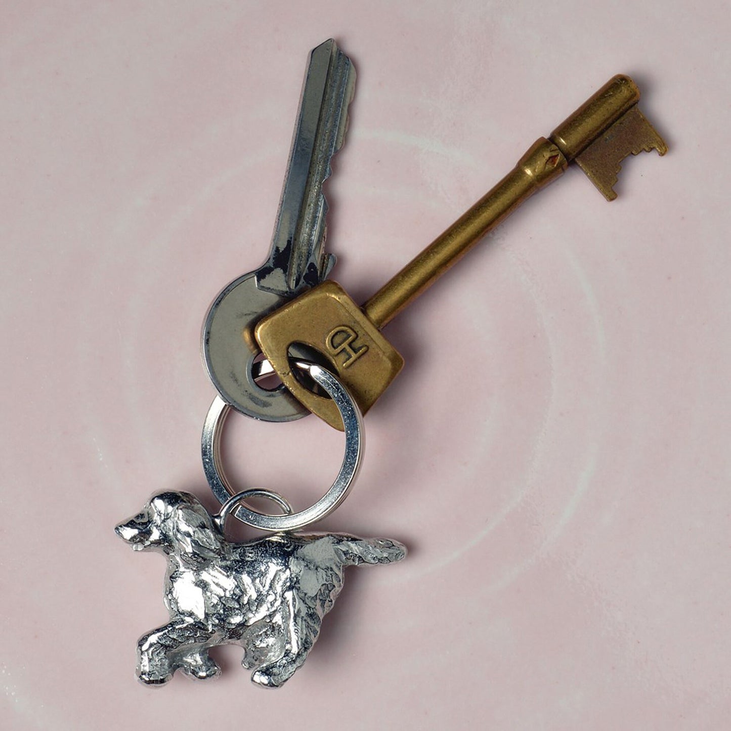 An elegant and beautiful solid pewter spaniel keyring on a quality stainless steel ring. Cocker Spaniel gifts, gifts for dog lovers. Springer Spaniel gifts, pewter keyring gifts. Housewarming gifts.