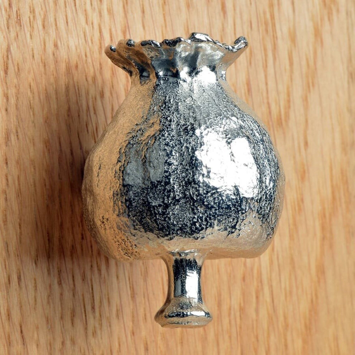 A solid pewter cabinet handle, cupboard knob, furniture handle or drawer pull in the shape of a detailed poppy seed pod. Organic, unusual handles UK handmade with finesse