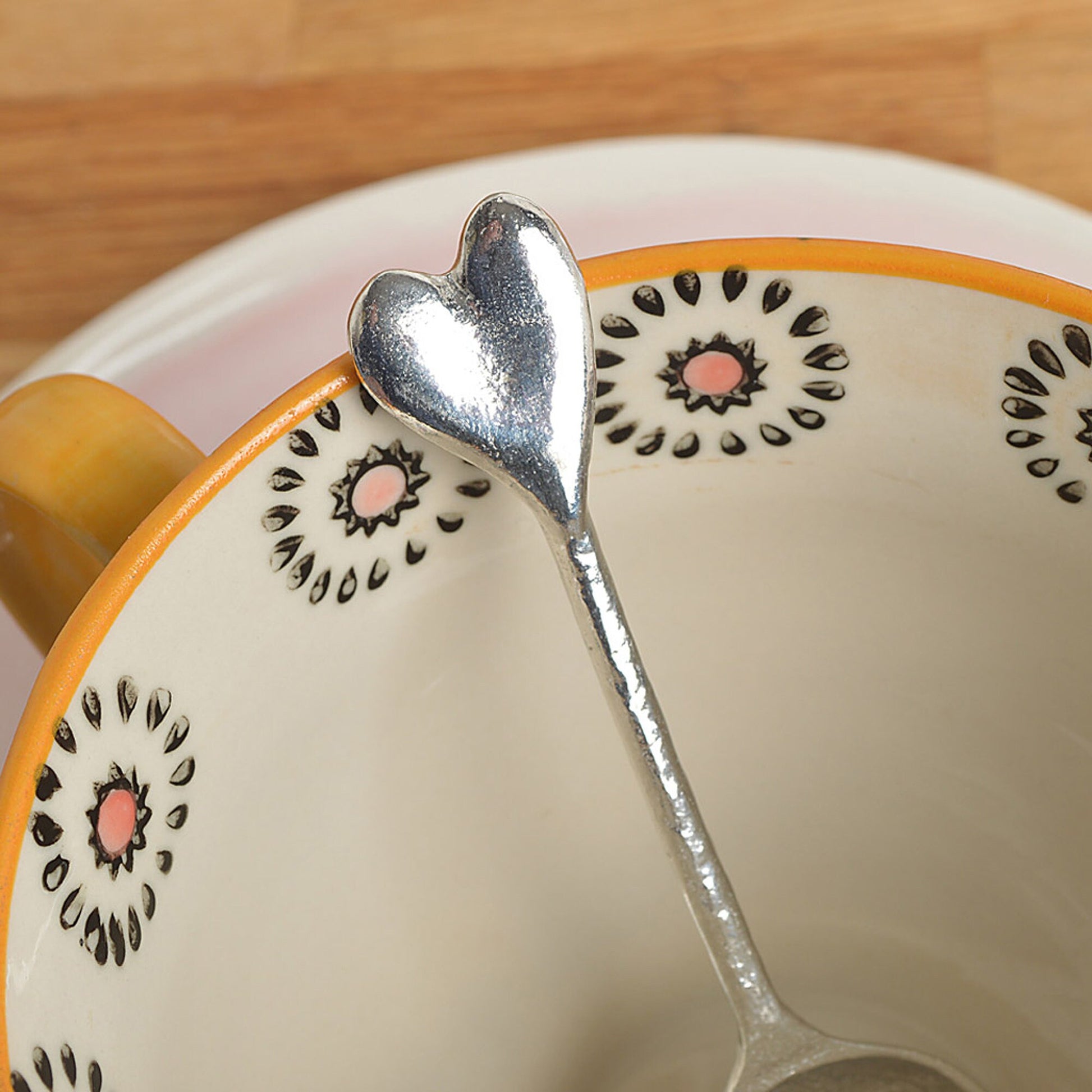 A small spoon pewter sugar teaspoon  with a love heart on the end. Our love spoon makes an ideal little love token or 10th tin wedding anniversary gift or small wedding gift.