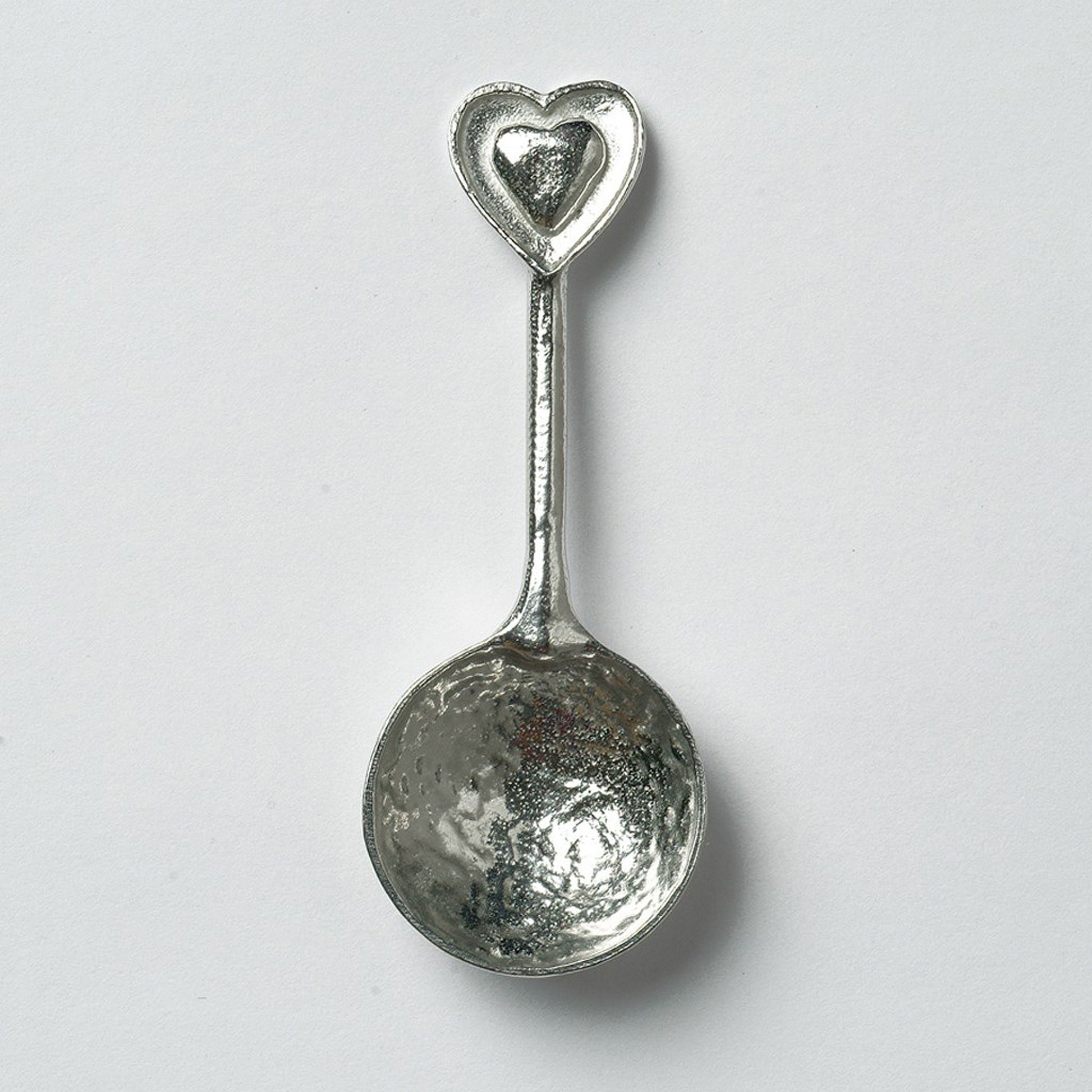 A small spoon pewter sugar spoon  with 2 love hearts on the end. Our love spoon makes an ideal little love token or 10th tin wedding anniversary gift or small wedding gift.