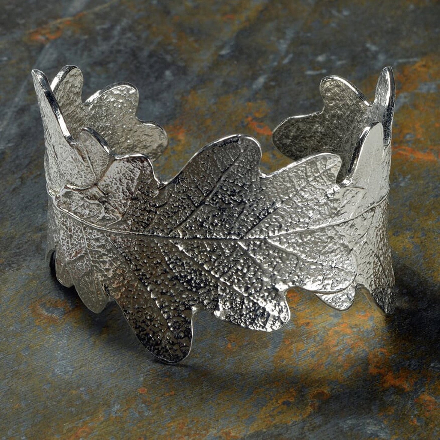 Pewter oak leaf cuff bangle, oak leaf bracelet gifts. 3 beautifully textured oak leaves overlap to create a stunning pewter oak leaf cuff bangle or bracelet. For anyone who loves big, but delicate, jewellery. Gifts for nature lovers.