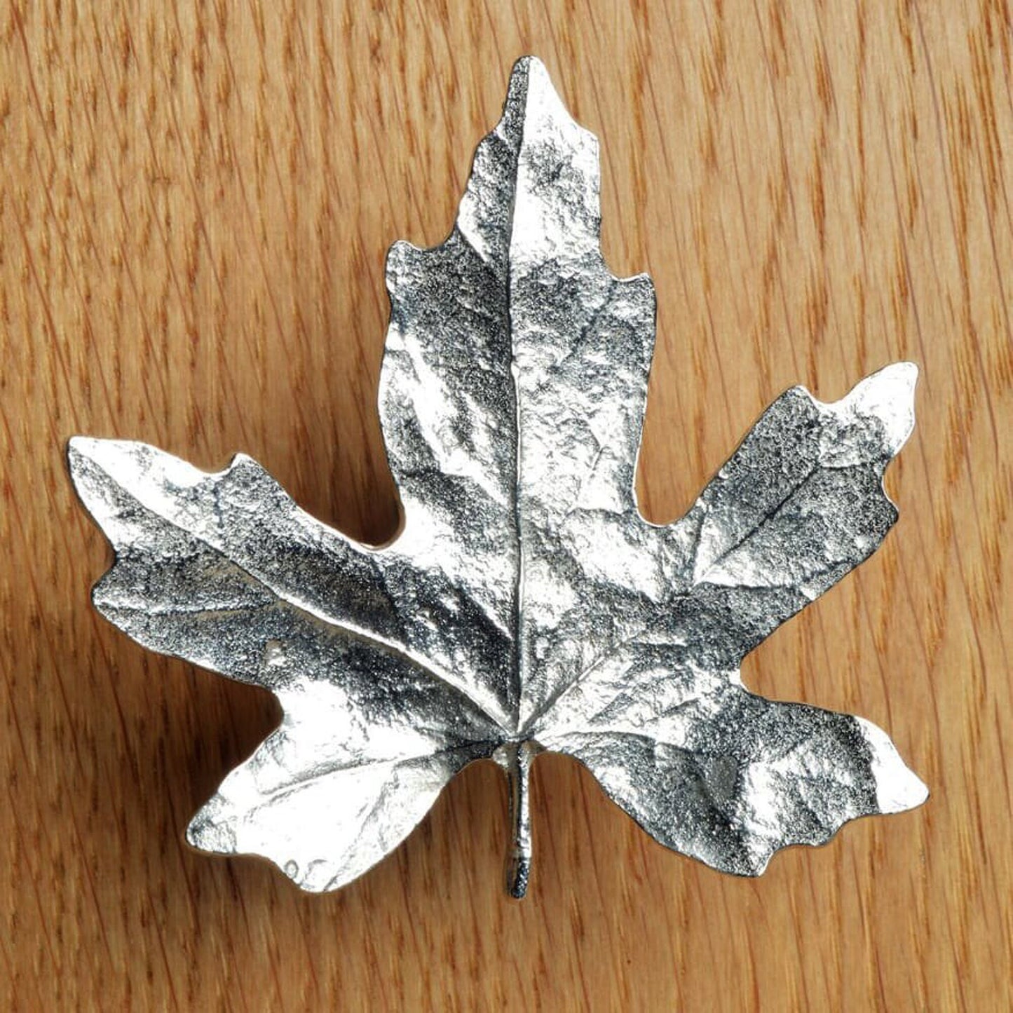 A solid pewter cabinet handle, cupboard knob, furniture handle or drawer pull in the shape of a detailed maple leaf. Organic, unusual handles UK handmade with finesse