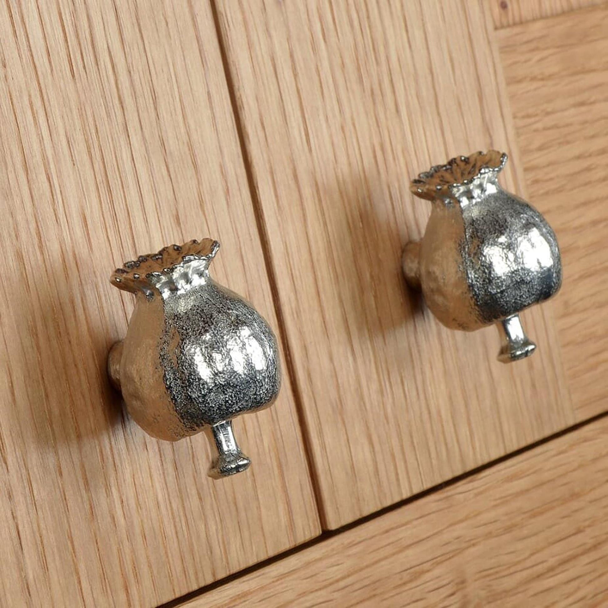 A solid pewter cabinet handle, cupboard knob, furniture handle or drawer pull in the shape of a detailed poppy seed pod. Organic, unusual handles UK handmade with finesse