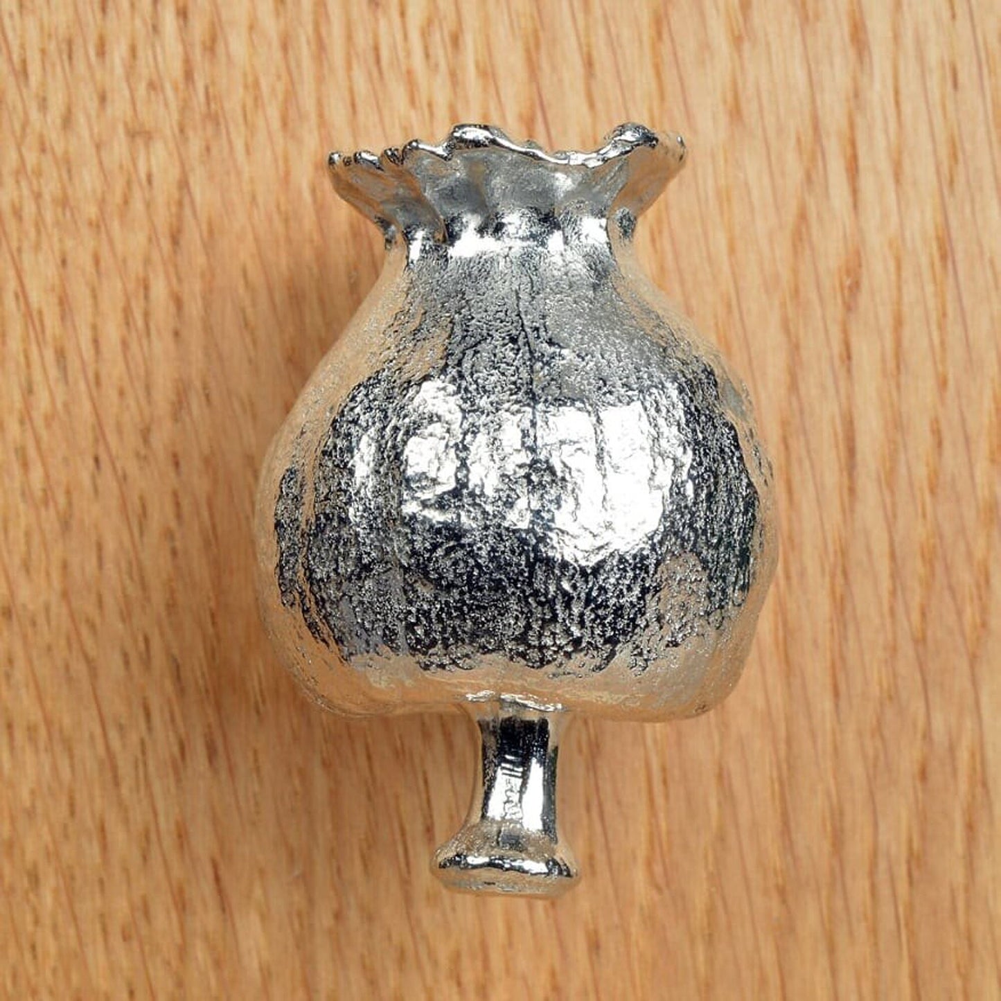 A solid pewter cabinet handle, cupboard knob, furniture handle or drawer pull in the shape of a detailed poppy seed pod. Organic, unusual handles UK handmade with finesse