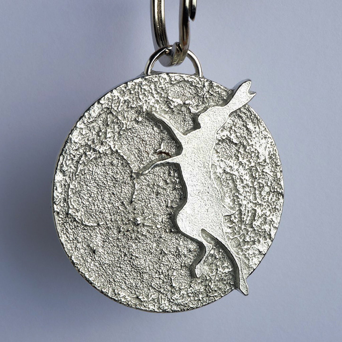 Boxing hare keyring dancing hare keyring, A hare silhouette dances in front of a beautifully textured moon. Solid pewter hare keyring on a quality stainless steel ring. Hare gifts, gifts for hare lovers, Pewter keyring gifts. Housewarming gifts.