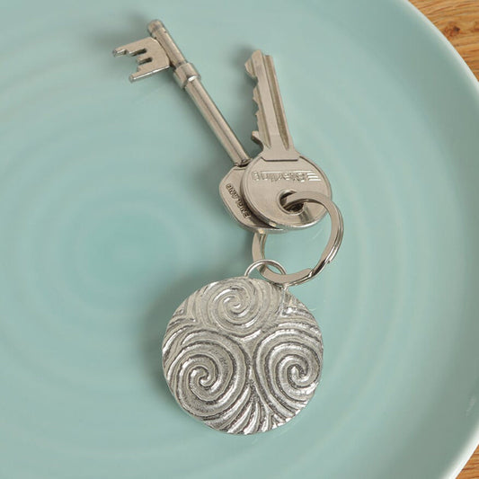 A detailed & pleasingly textured pewter Neolithic Spiral of Life relief keyring on a stainless steel ring. Triskelion key ring, spiral of life gifts, pewter keyring gifts. Housewarming gifts.