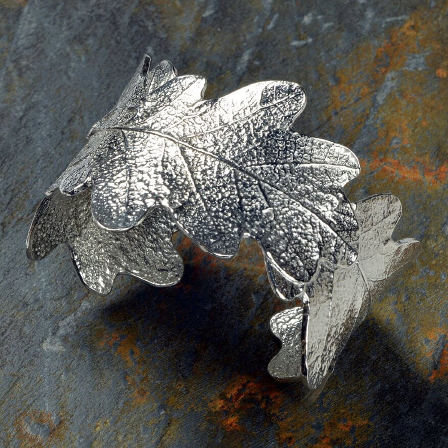 Pewter oak leaf cuff bangle, oak leaf bracelet gifts. 3 beautifully textured oak leaves overlap to create a stunning pewter oak leaf cuff bangle or bracelet. For anyone who loves big, but delicate, jewellery. Gifts for nature lovers.