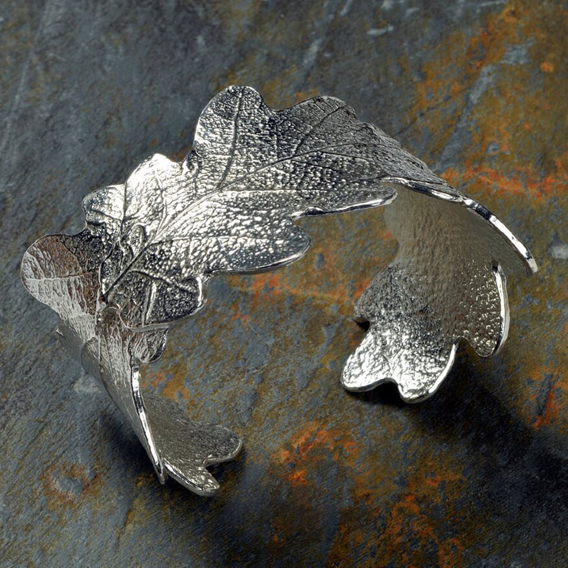 Pewter oak leaf cuff bangle, oak leaf bracelet gifts. 3 beautifully textured oak leaves overlap to create a stunning pewter oak leaf cuff bangle or bracelet. For anyone who loves big, but delicate, jewellery. Gifts for nature lovers.