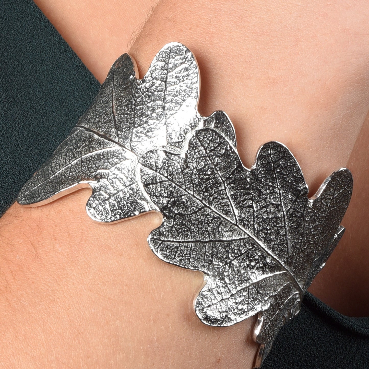 Pewter oak leaf cuff bangle, oak leaf bracelet gifts. 3 beautifully textured oak leaves overlap to create a stunning pewter oak leaf cuff bangle or bracelet. For anyone who loves big, but delicate, jewellery. Gifts for nature lovers.