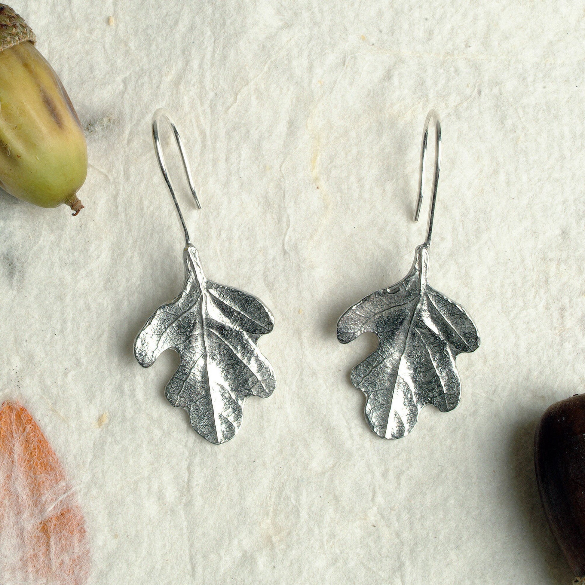 Oak leaf drop earrings, pewter oak leaves on Sterling silver ear hooks. Pewter and silver leaf jewellery gifts, handmade in the UK by Glover and Smith