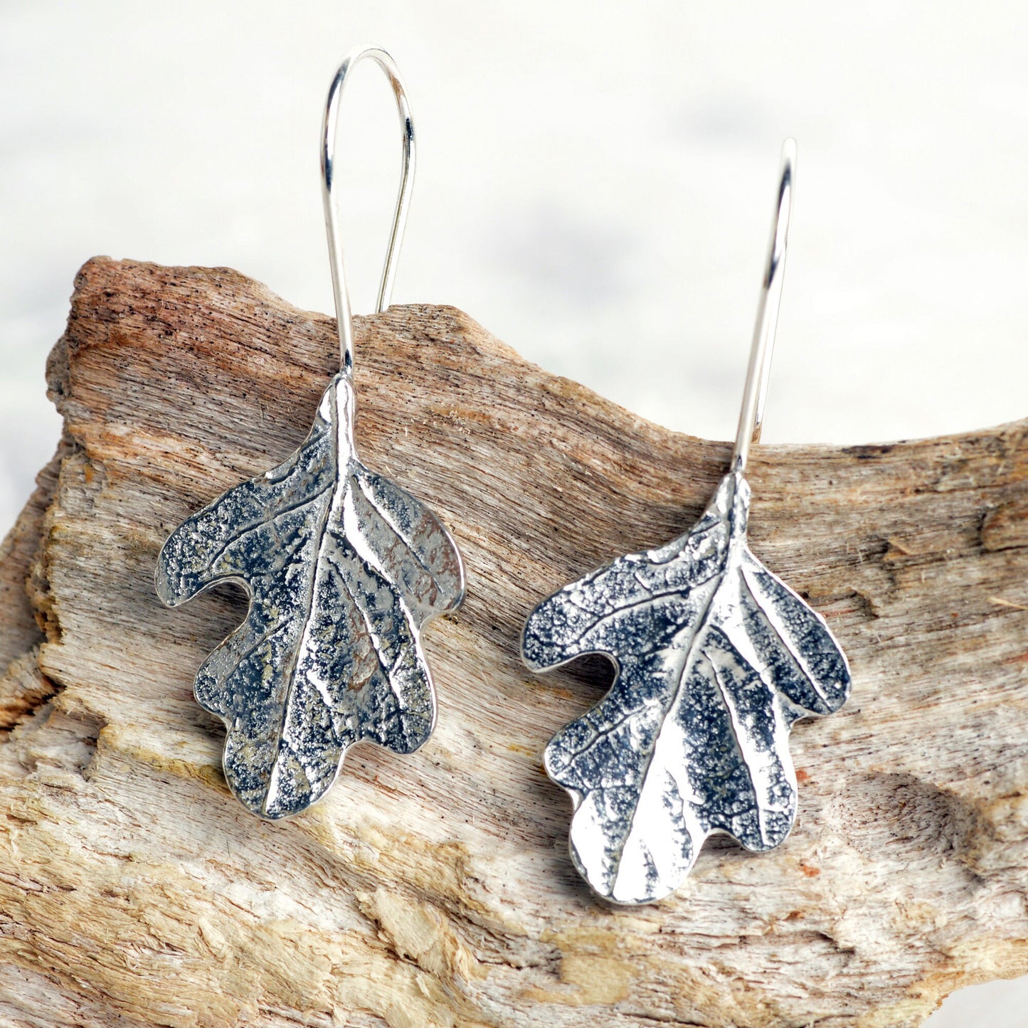 Oak leaf drop earrings, pewter oak leaves on Sterling silver ear hooks. Pewter and silver leaf jewellery gifts, handmade in the UK by Glover and Smith