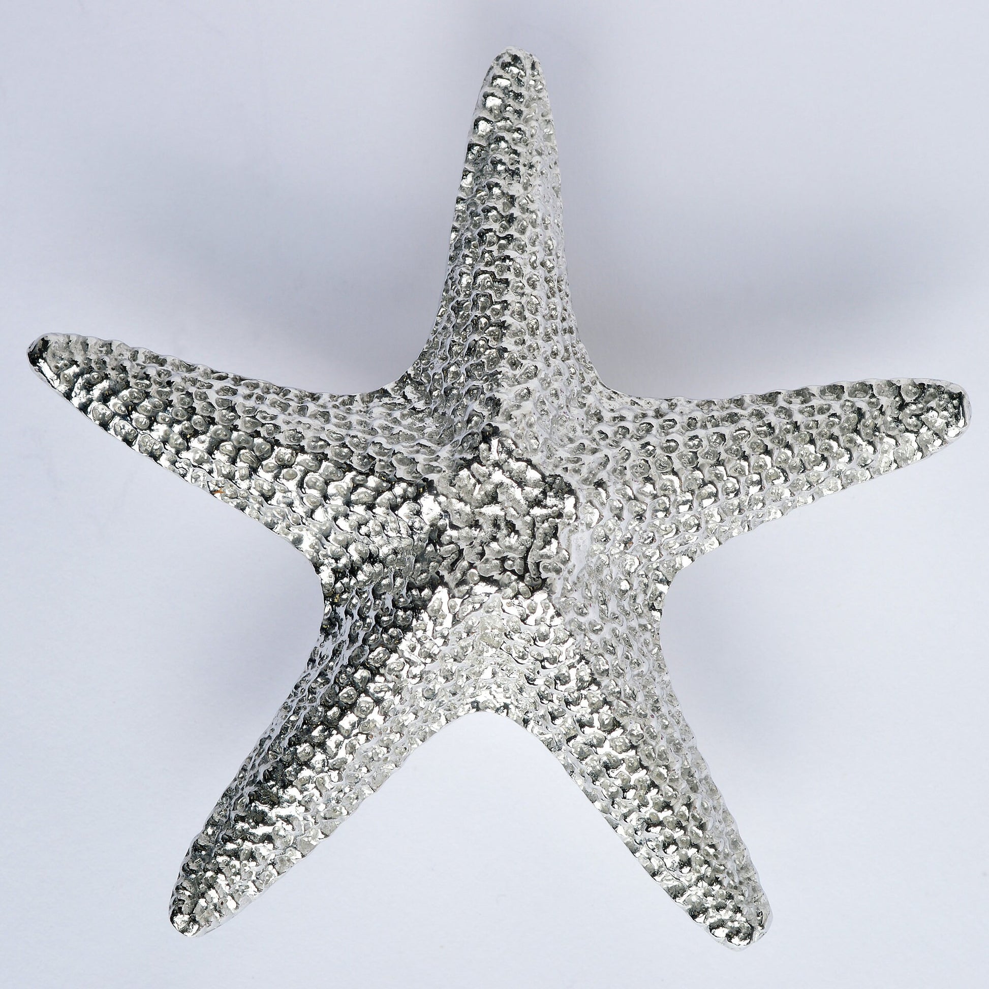 A solid pewter cabinet handle, cupboard knob, furniture handle or drawer pull in the shape of a detailed starfish. Organic, unusual handles UK handmade with finesse