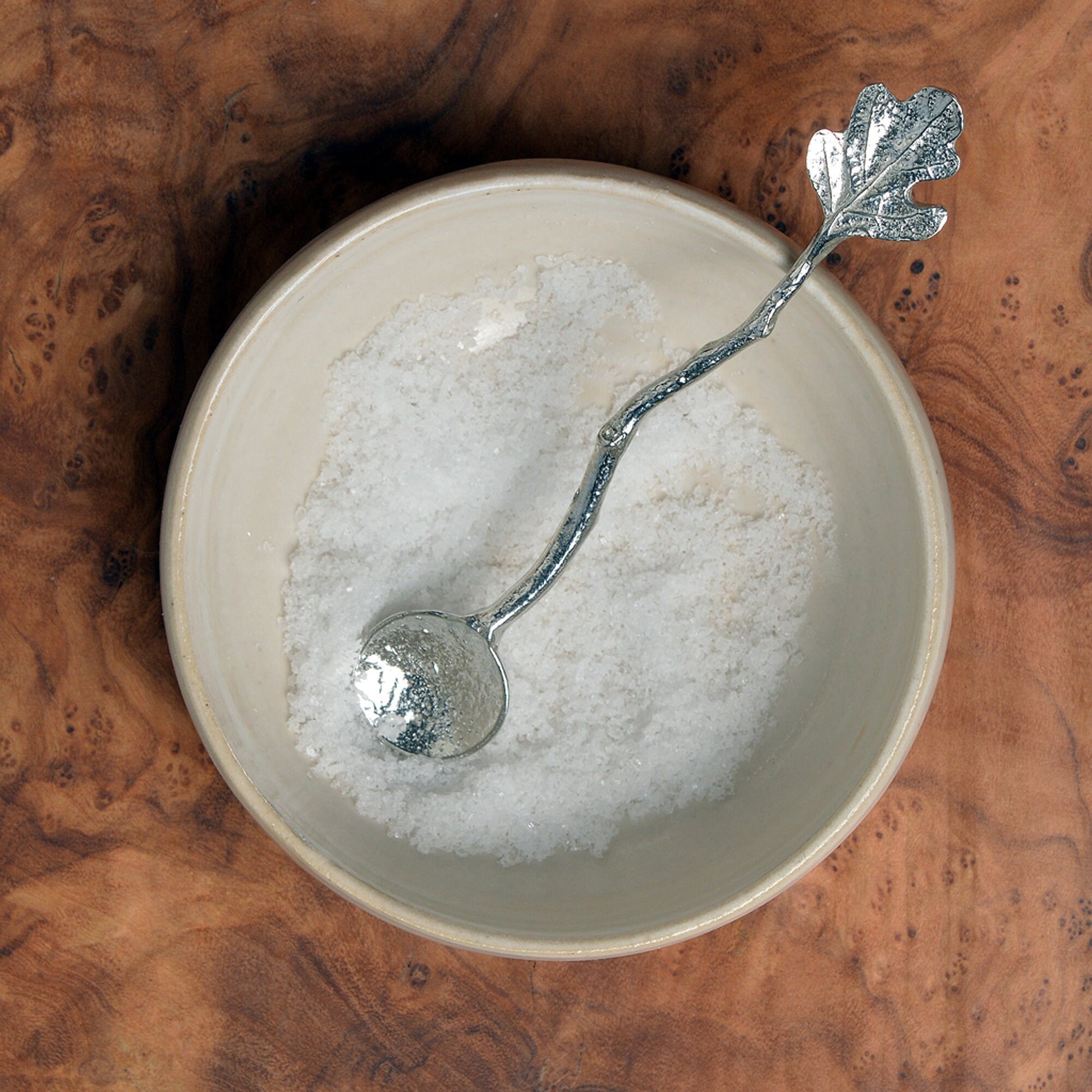 a tiny spice, salt or condiment spoon. Our pewter spoon has a small 10mm bowl leading up a fine twig textured handle to a small oak leaf. Practical & useful gifts for nature lovers.