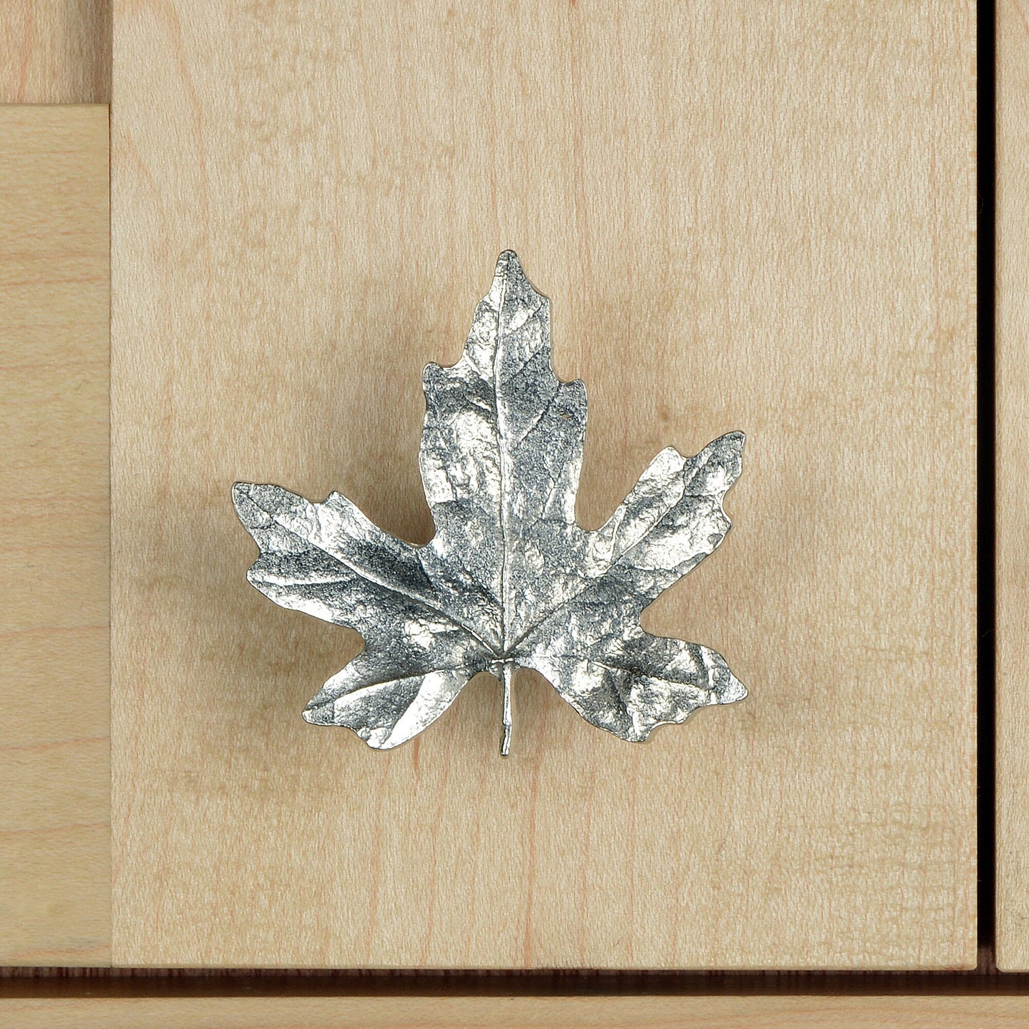 A solid pewter cabinet handle, cupboard knob, furniture handle or drawer pull in the shape of a detailed maple leaf. Organic, unusual handles UK handmade with finesse