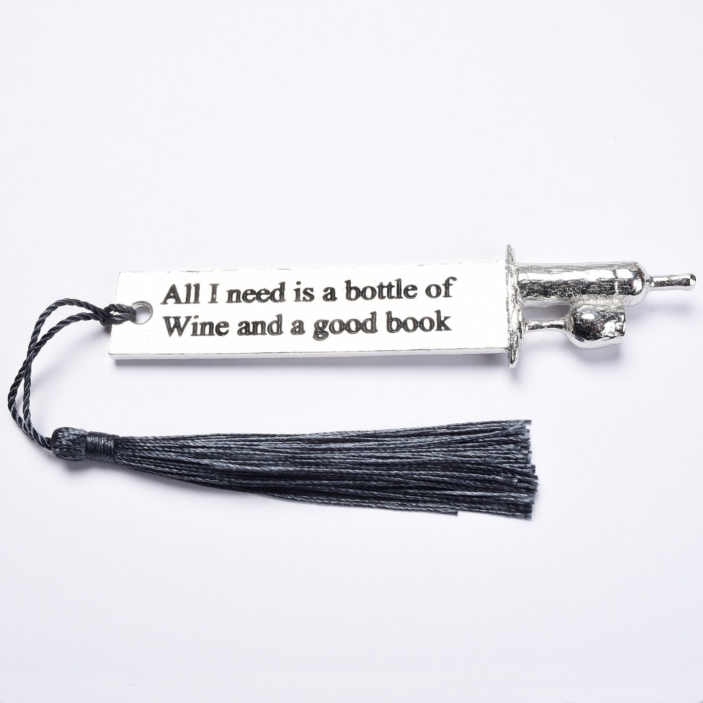 A personalised engraved pewter metal  bookmark with a wine bottle and glass on the top. On the front the quotation 'All I need is a bottle of wine and a good book'. We engrave the back with your message. Gifts for wine lovers, book lovers gifts.