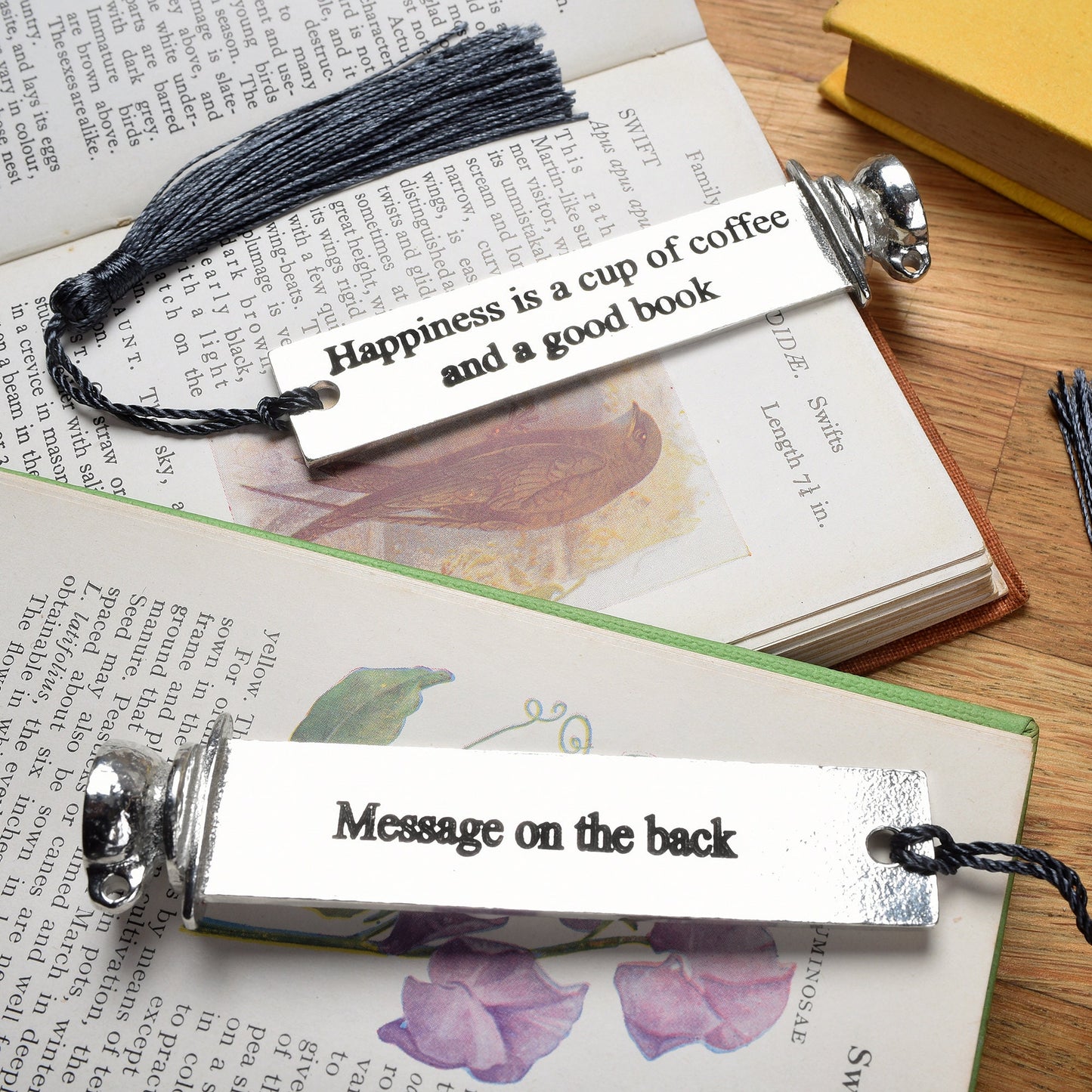 A personalised engraved pewter metal  bookmark with a coffee cup on the top. On the front the quotation 'Happiness is a cup of coffee and a good book'. We engrave the back with your message. Gifts for coffee lovers, book lovers gifts.