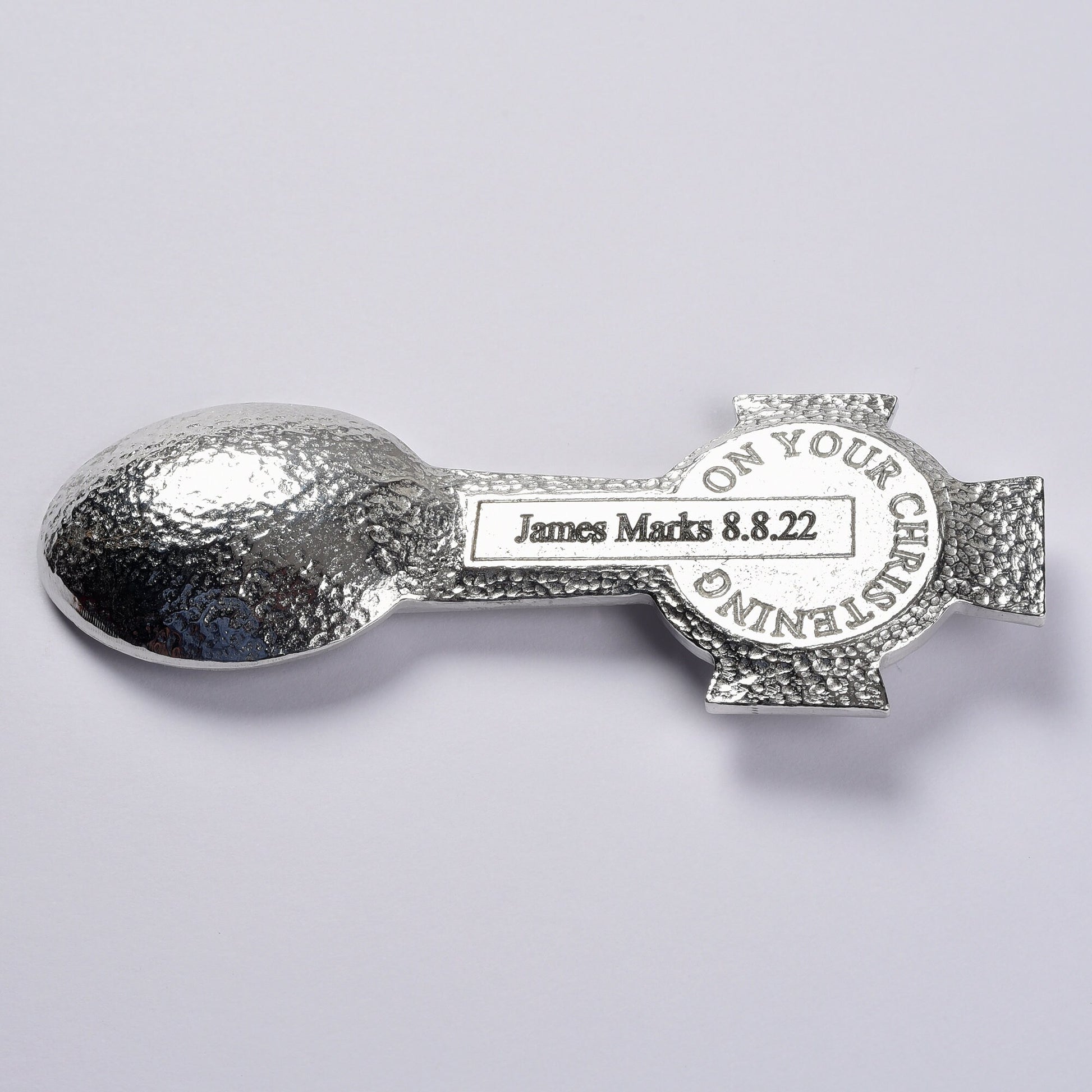 A Celtic cross designed Christening spoon with the words On Your Christening on the back. We engrave your message on the central panel. Christening gifts for boys and girls. UK handmade