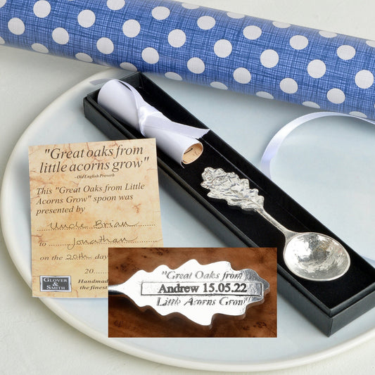 A personalised, engraved pewter oak leaf topped spoon. 'Great oaks from little acorns grow' is written on the back with a space where we engrave your message. Christening gifts for boys and girls