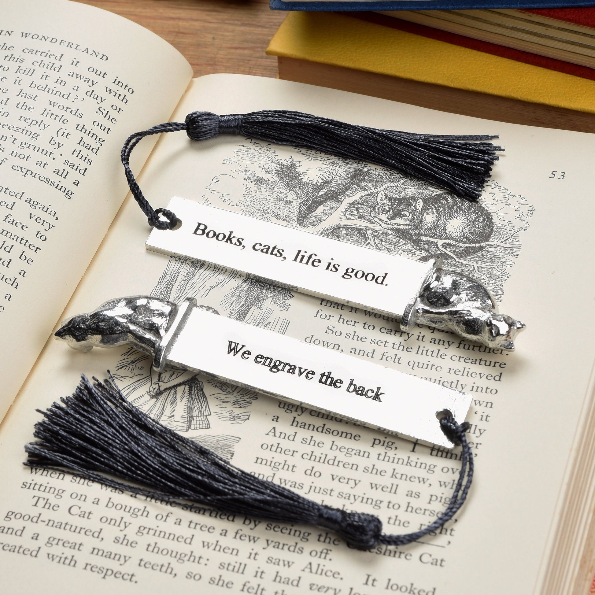 A personalized engraved pewter metal  bookmark with a cat sculpture on the top. On the front the quotation 'Books, cats, life is good'. We engrave the back with your message. Gifts for cat lovers, book lovers gifts, cat gifts.