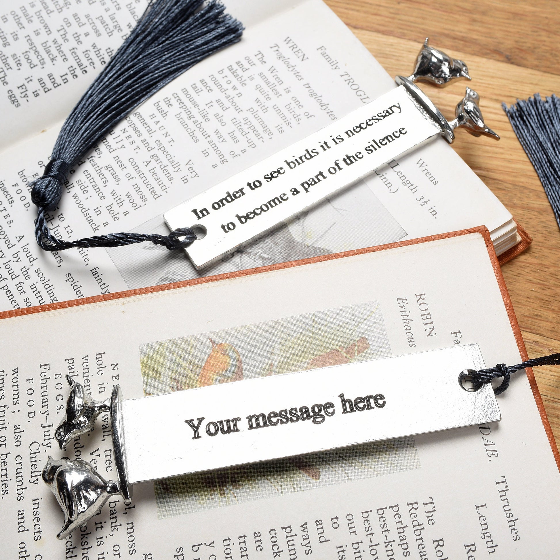 A personalised engraved pewter metal  bookmark with a wren and a robin on the top. On the front the quotation 'In order to see birds it is necessary to become part of the silence'. We engrave the back with your message. Gifts for bird lovers, book lovers