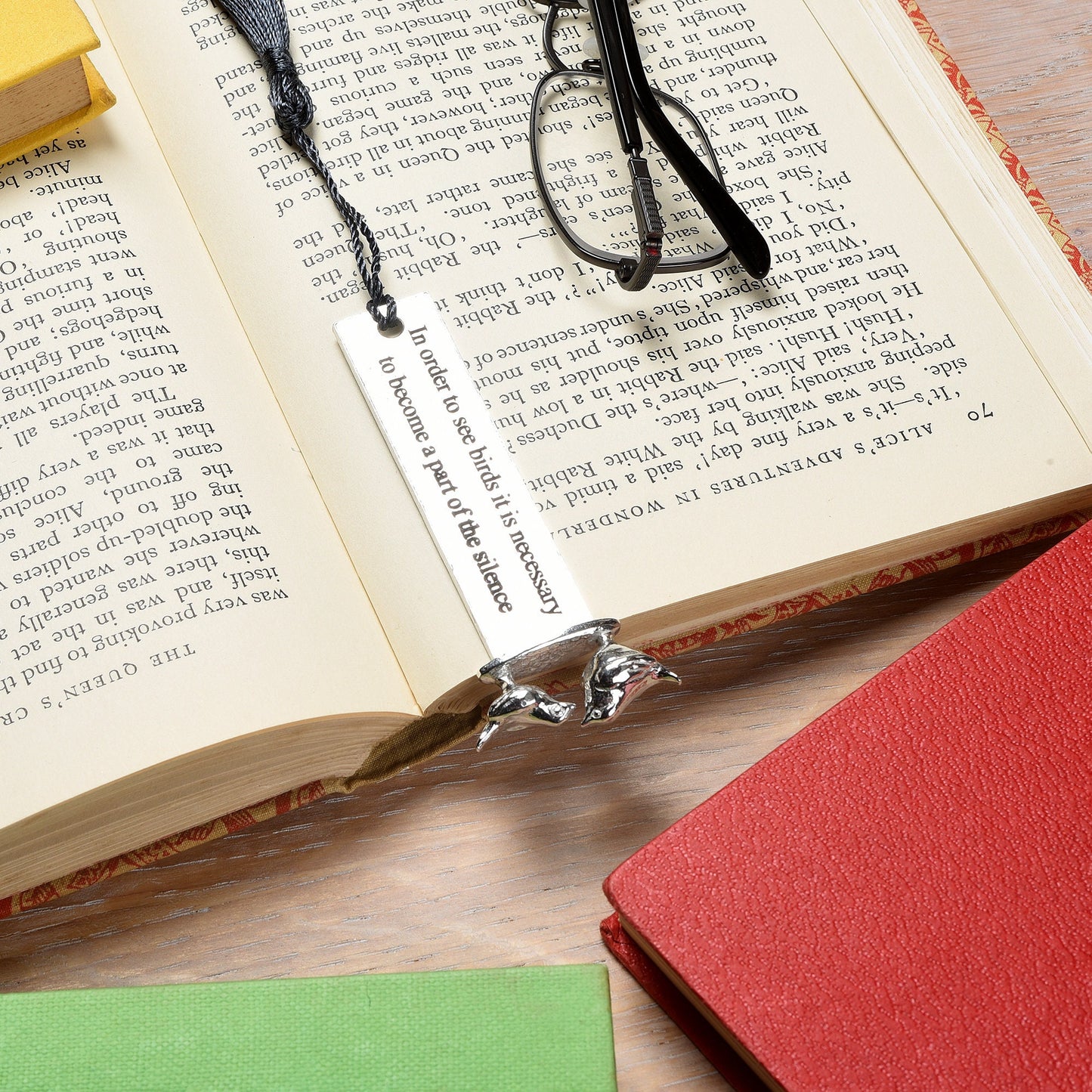 A personalised engraved pewter metal  bookmark with a wren and a robin on the top. On the front the quotation 'In order to see birds it is necessary to become part of the silence'. We engrave the back with your message. Gifts for bird lovers, book lovers