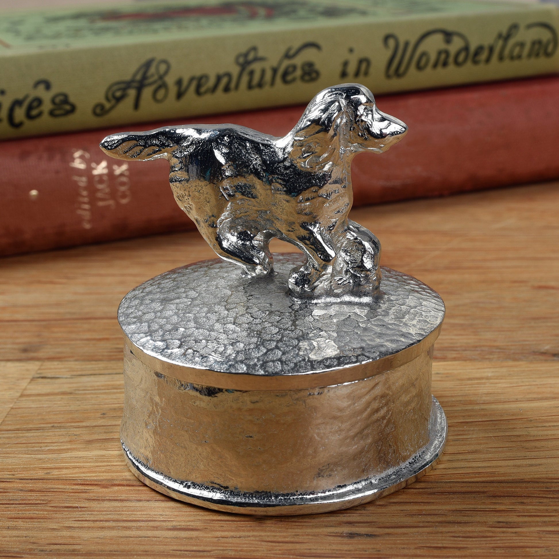 Spaniel pewter personalised trinket box. Our round spaniel keepsake box features a running springer spaniel sculpture as a handle. The underside of the lid can be engraved with your personalised message. Dog gifts, personalised gifts for dog lovers.