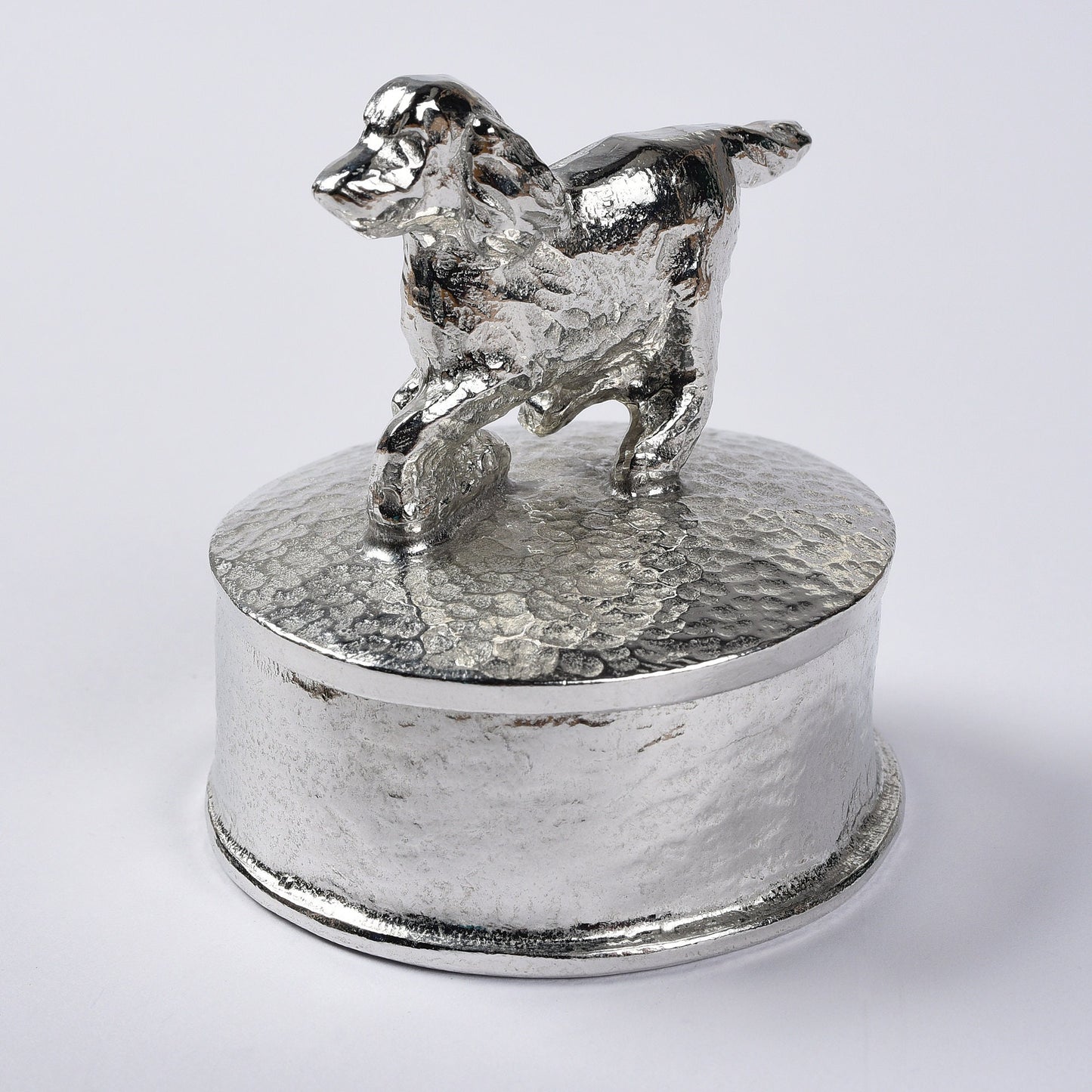 Spaniel pewter personalised trinket box. Our round spaniel keepsake box features a running springer spaniel sculpture as a handle. The underside of the lid can be engraved with your personalised message. Dog gifts, personalised gifts for dog lovers.