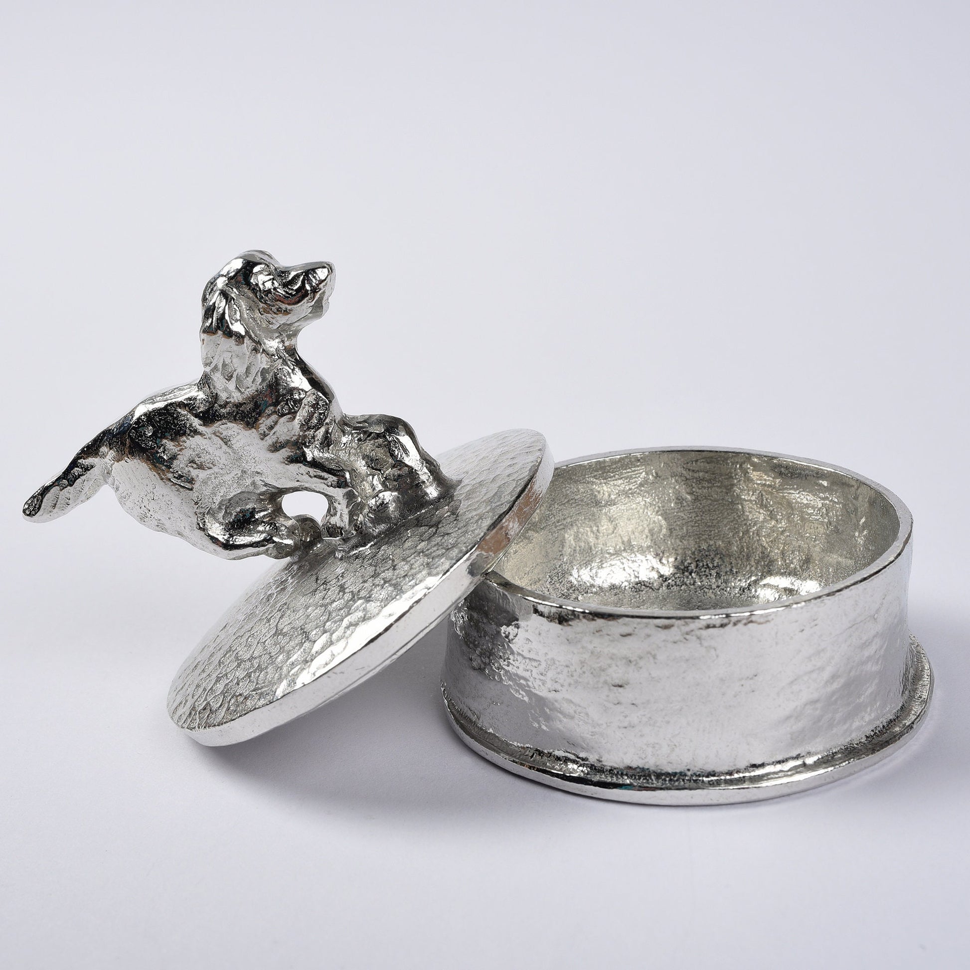 Spaniel pewter personalised trinket box. Our round spaniel keepsake box features a running springer spaniel sculpture as a handle. The underside of the lid can be engraved with your personalised message. Dog gifts, personalised gifts for dog lovers.